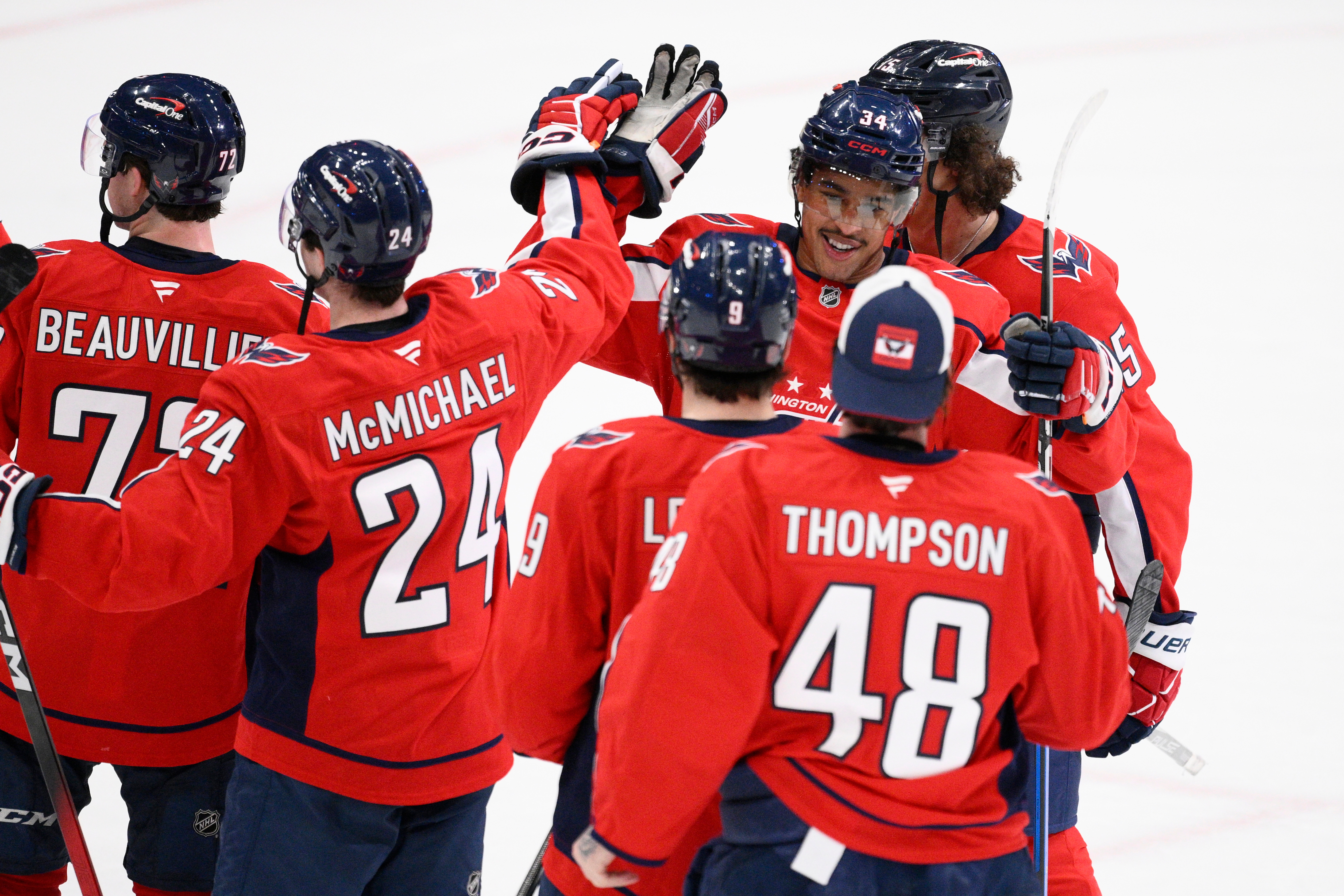 Washington Capitals right wing Justin Sourdif (34) celebrates with teammates...