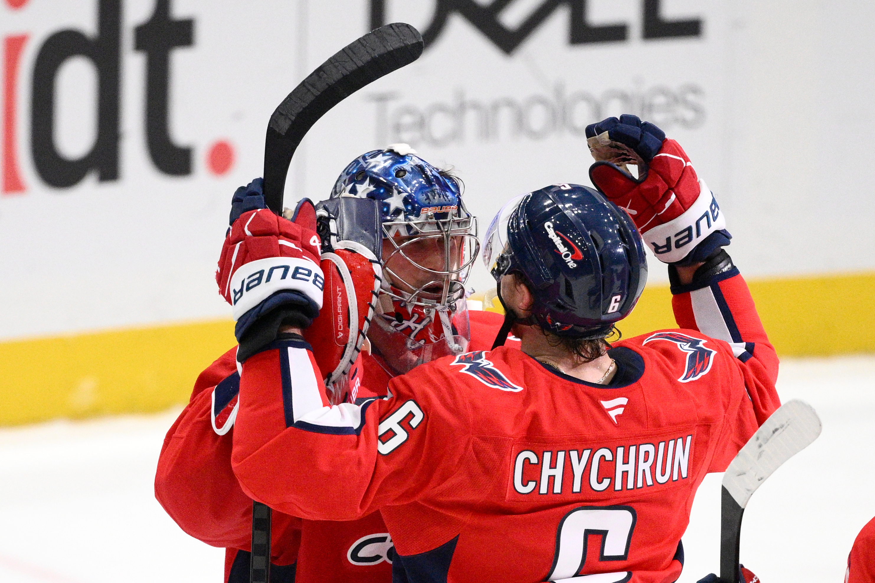 Washington Capitals goaltender Charlie Lindgren, left, and defenseman Jakob Chychrun...