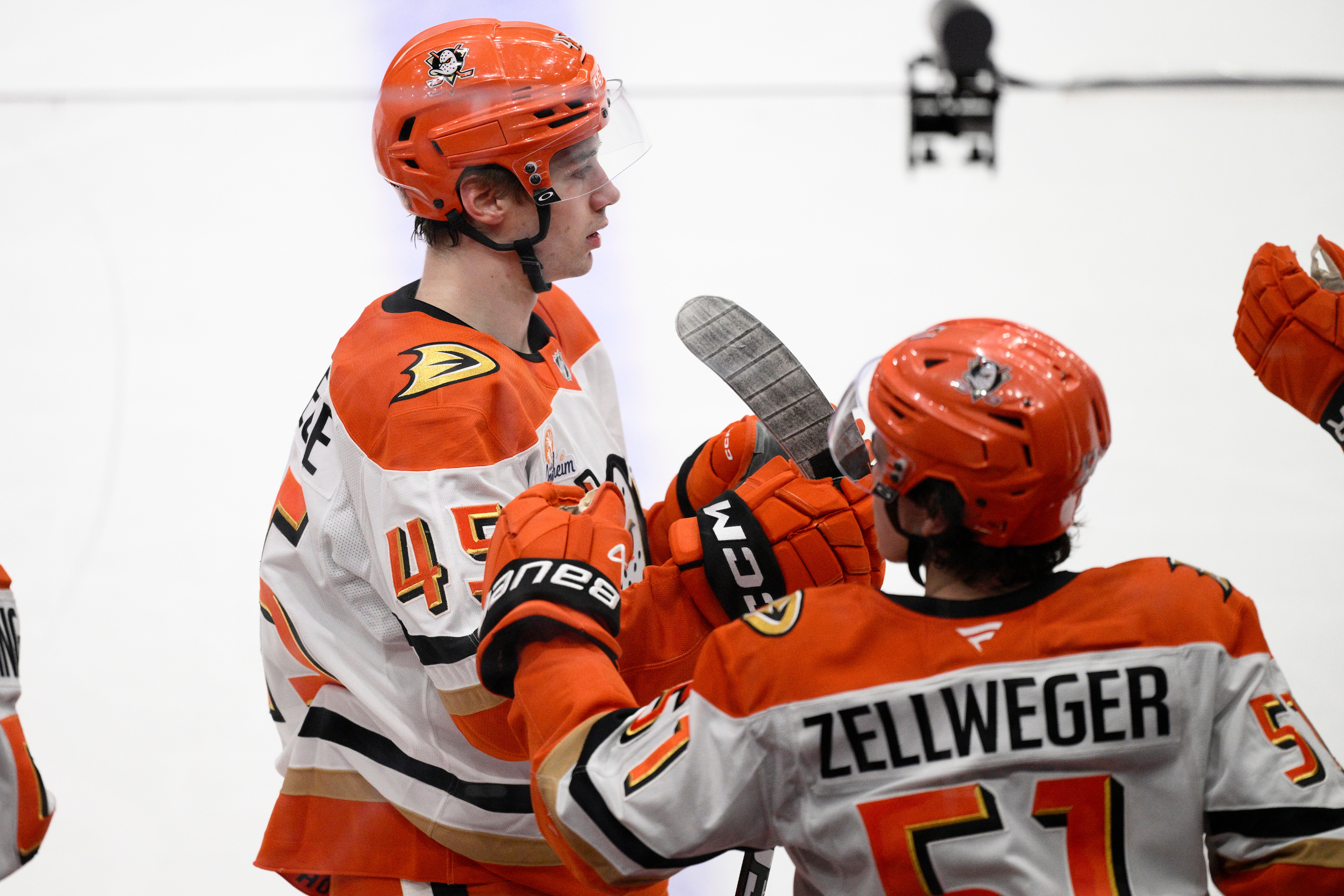 Ducks right wing Beckett Sennecke, left, celebrates after scoring a...