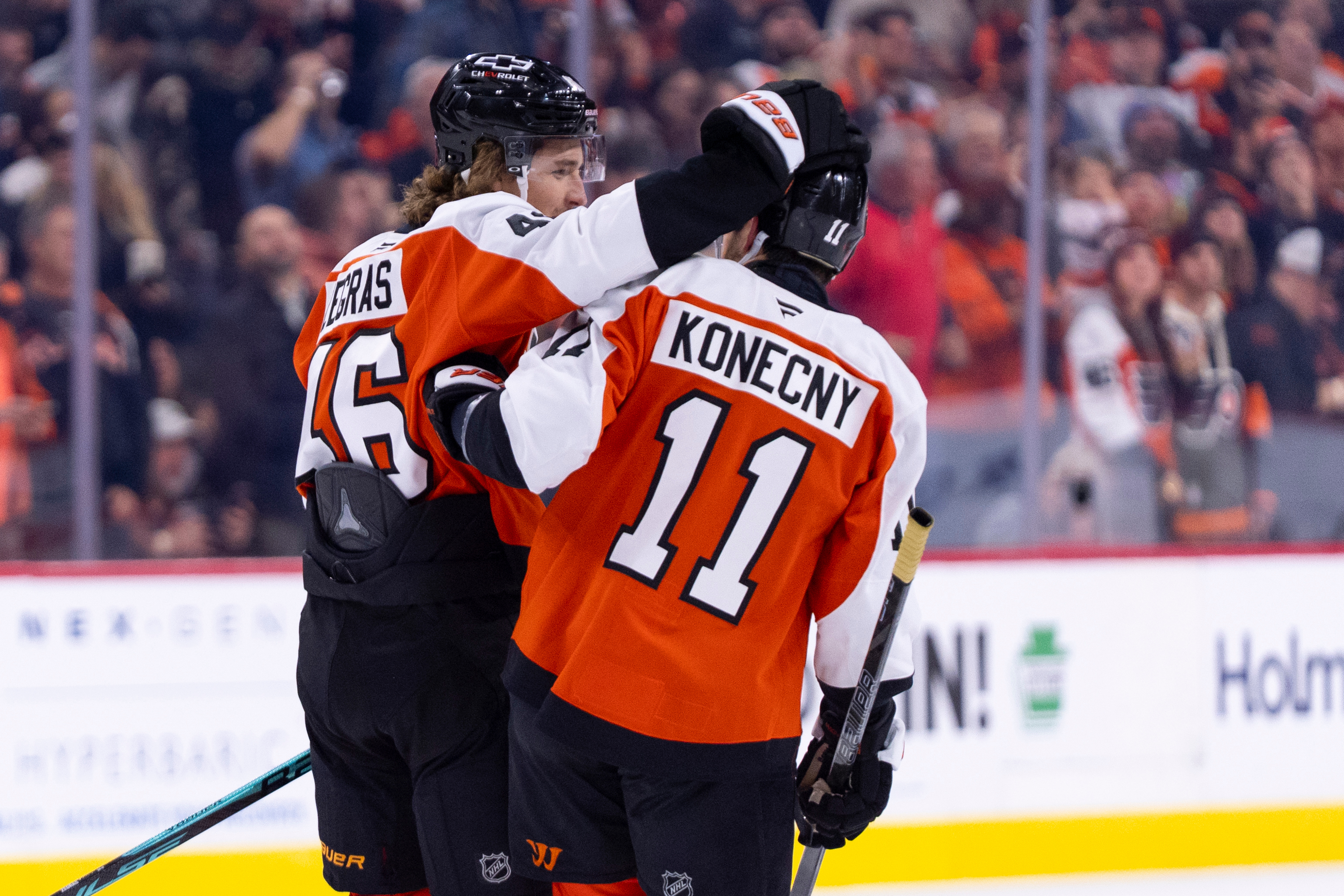 The Philadelphia Flyers’ Trevor Zegras, left, celebrates with Travis Konecny...