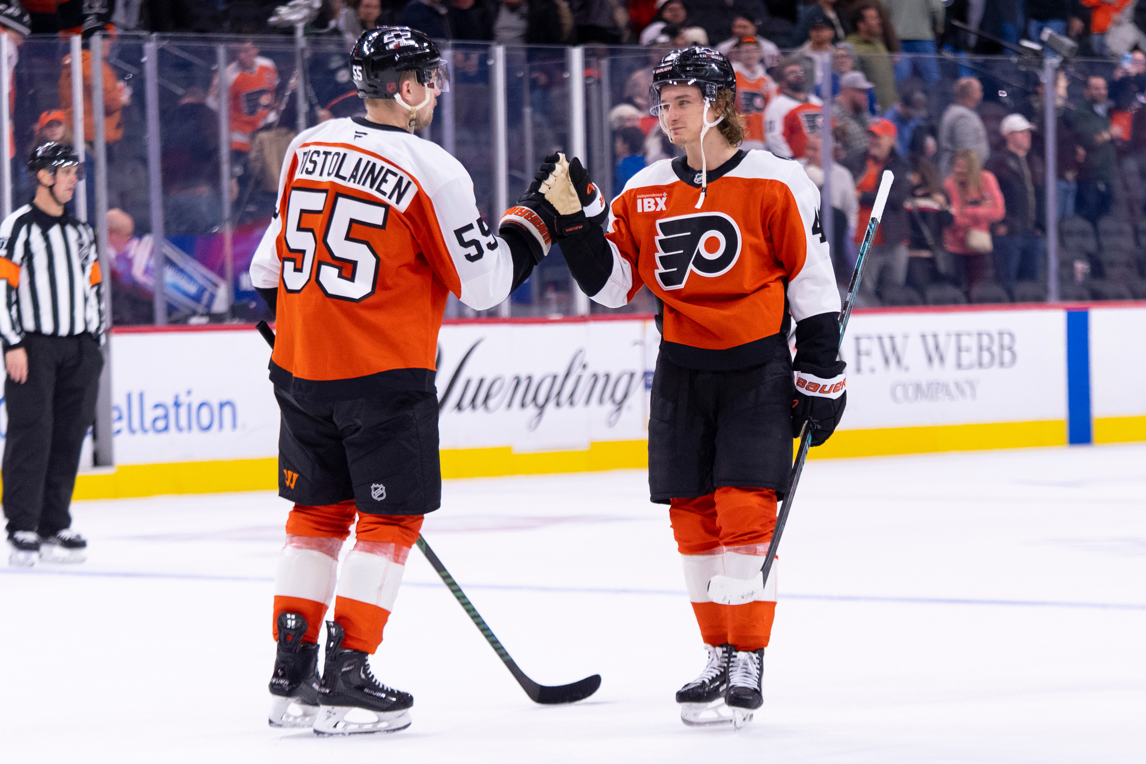 The Philadelphia Flyers’ Trevor Zegras, right, celebrates with Rasmus Ristolainen,...