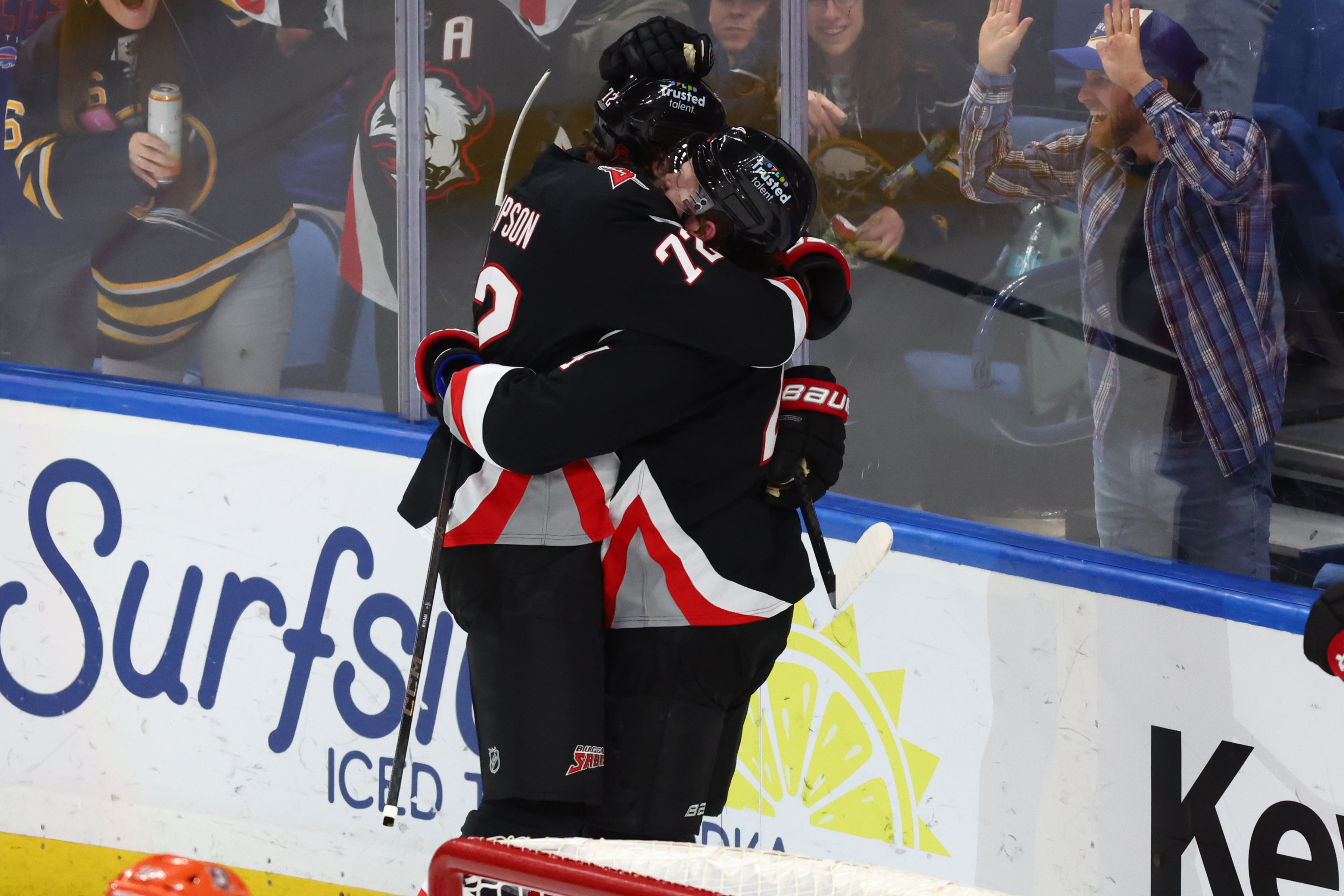 Buffalo Sabres defenseman Bowen Byram, right, celebrates after his goal...