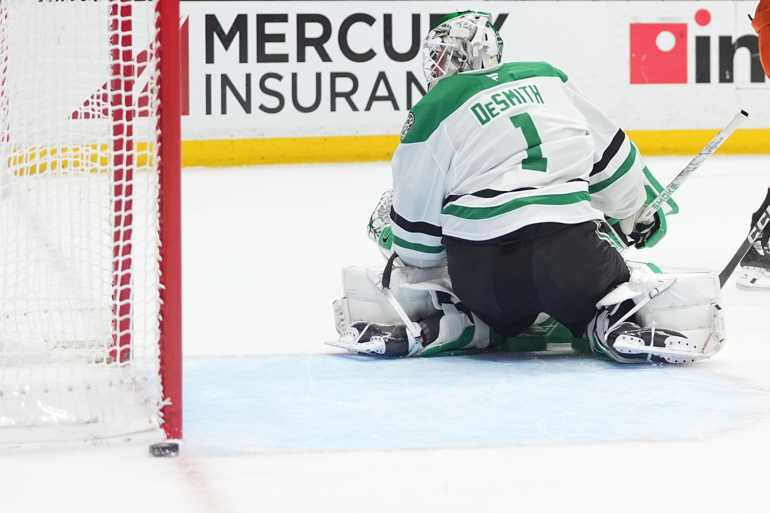 Dallas Stars goaltender Casey DeSmith turns around to see a...