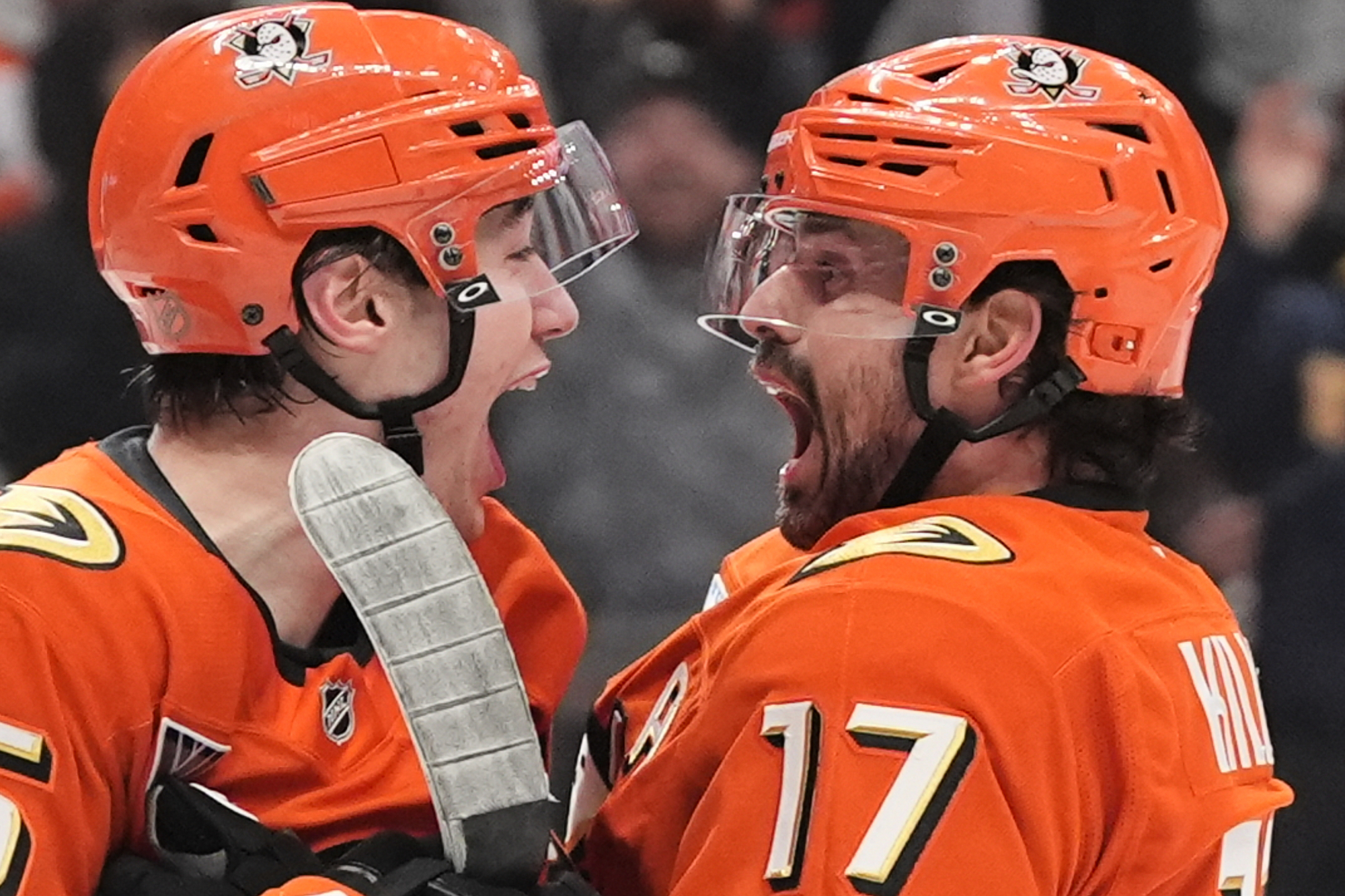 Ducks right wing Beckett Sennecke, left, celebrates his goal with...