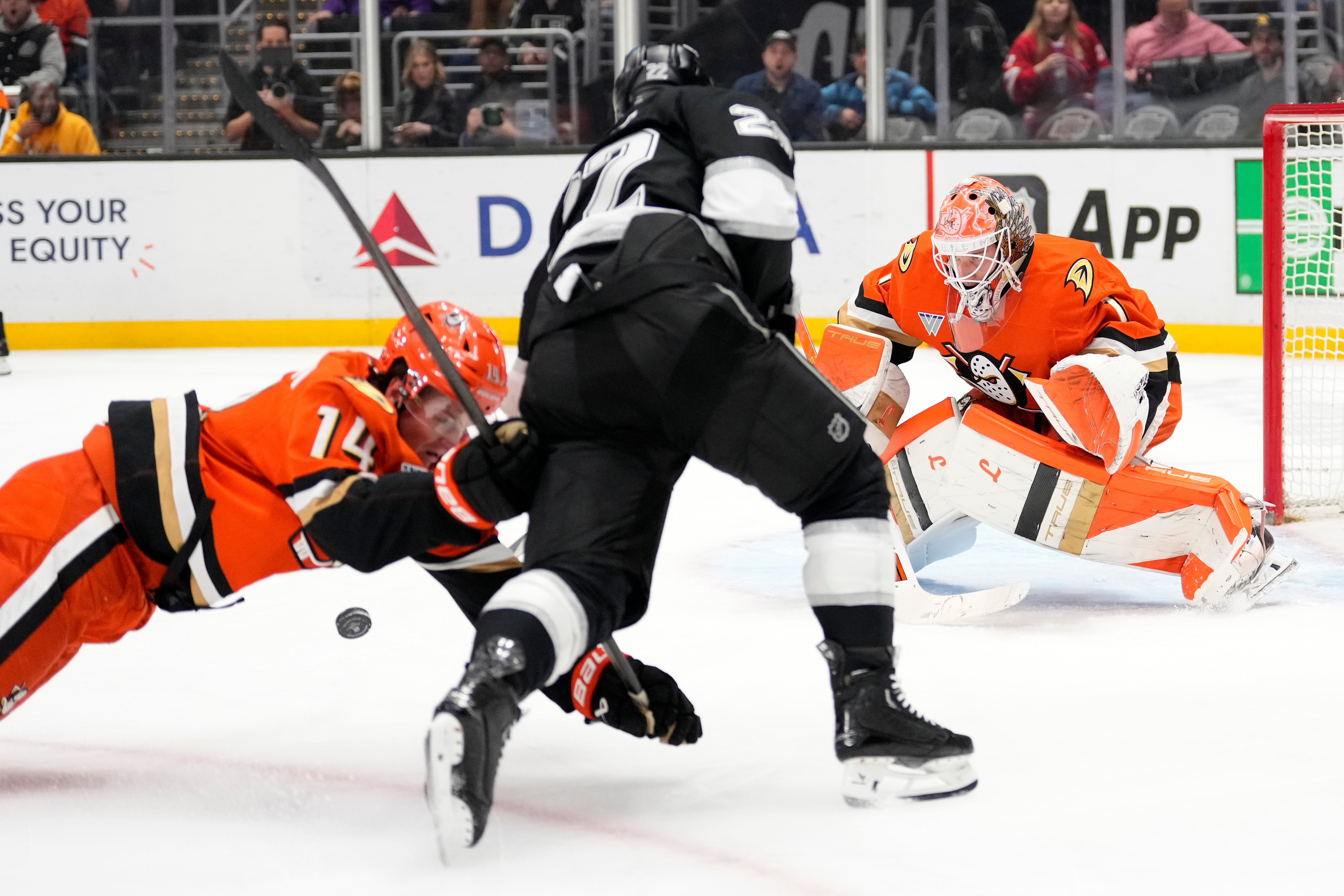 Ducks defenseman Drew Helleson, left, and goaltender Lukas Dostal, right,...