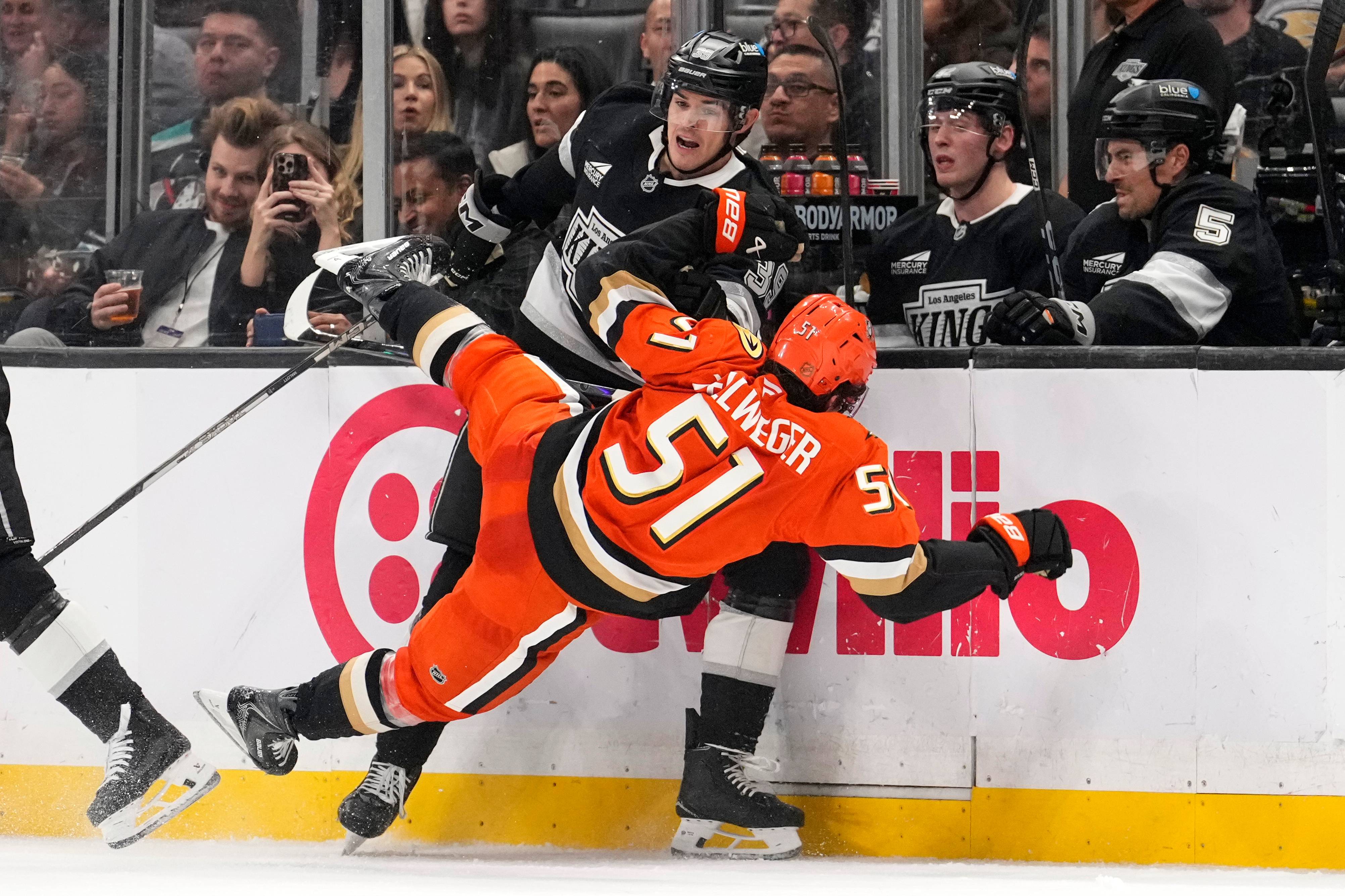 Kings left wing Jeff Malott, top, knocks Ducks defenseman Olen...