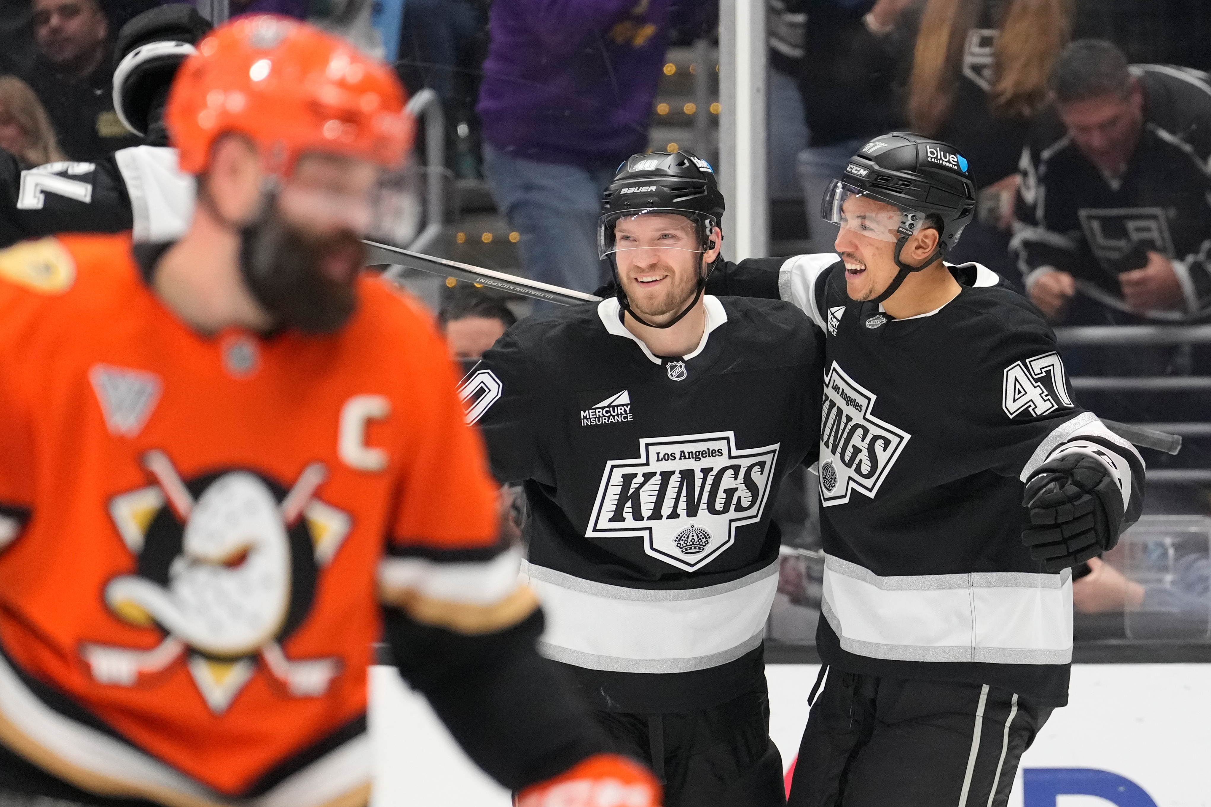 Kings right wing Joel Armia, center, celebrates his goal with...