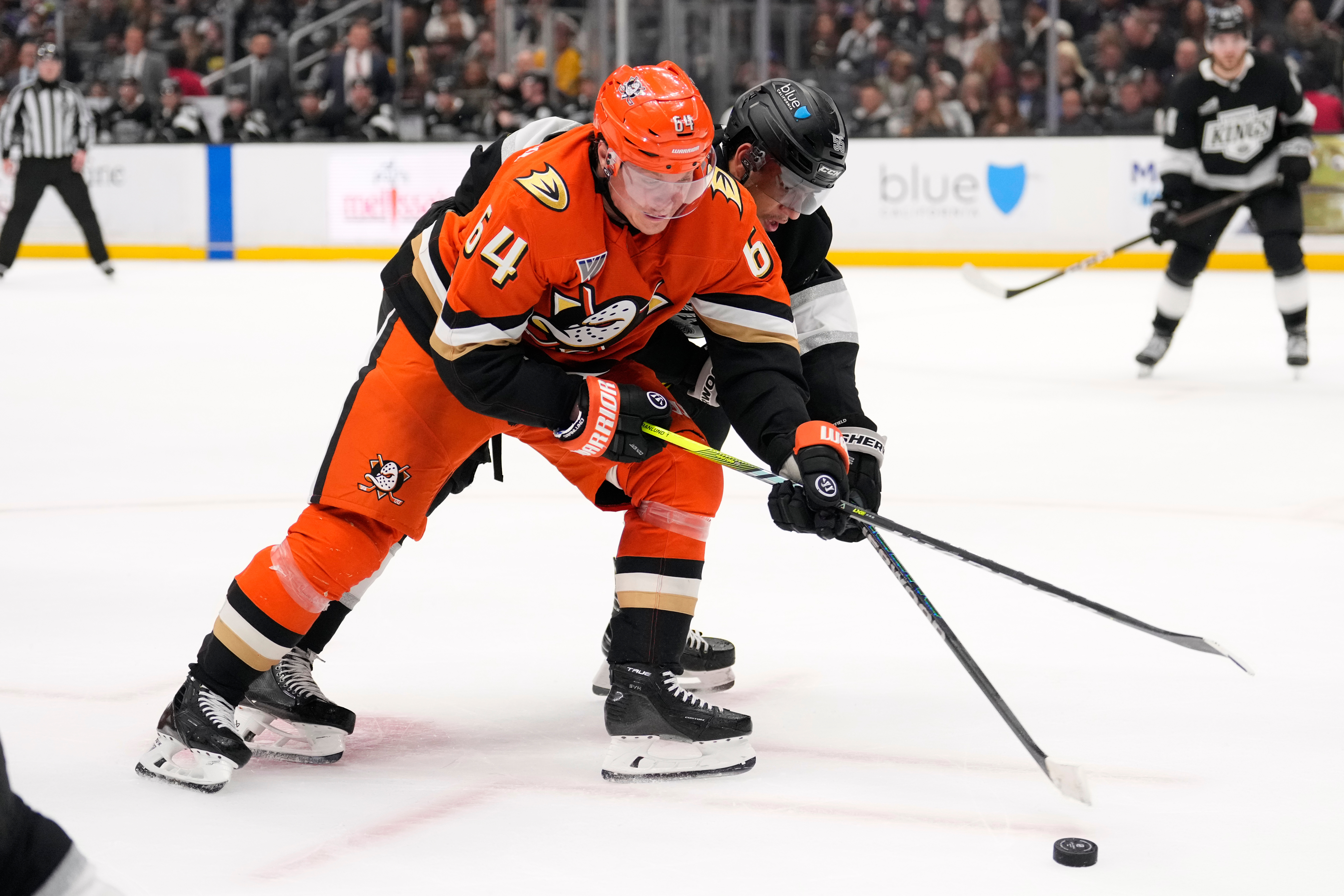 Ducks center Mikael Granlund, left, and Kings right wing Quinton...