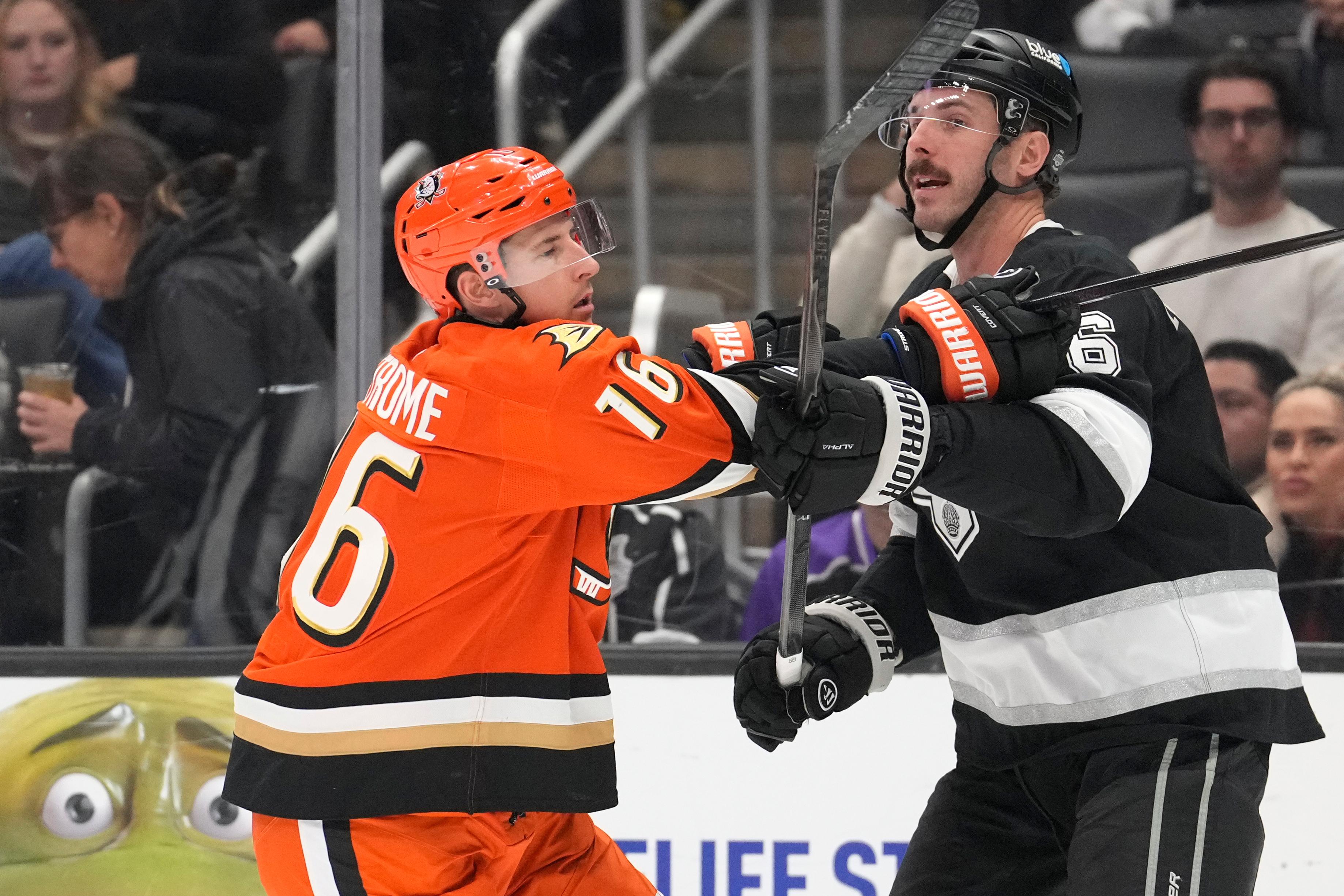 Ducks center Ryan Strome, left, and Kings defenseman Joel Edmundson...