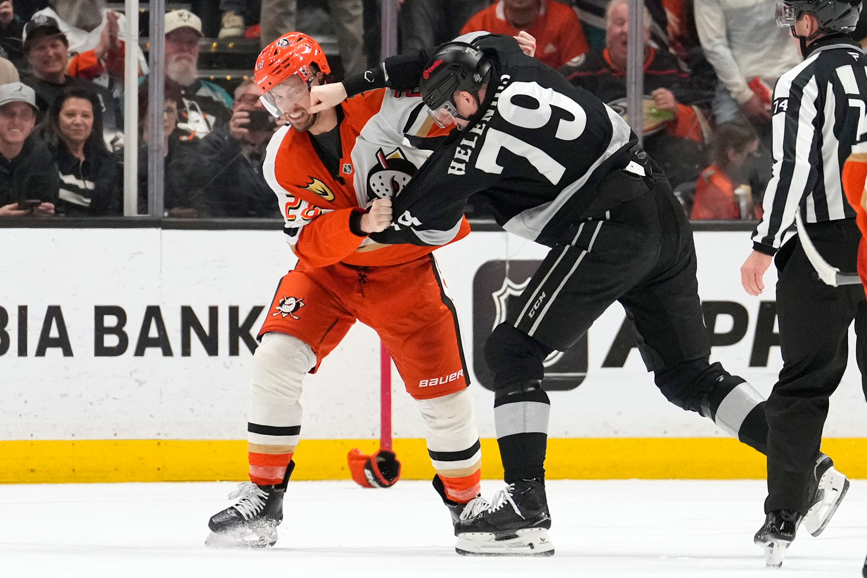 Ducks left wing Jeffrey Viel, left, and Kings center Samuel...