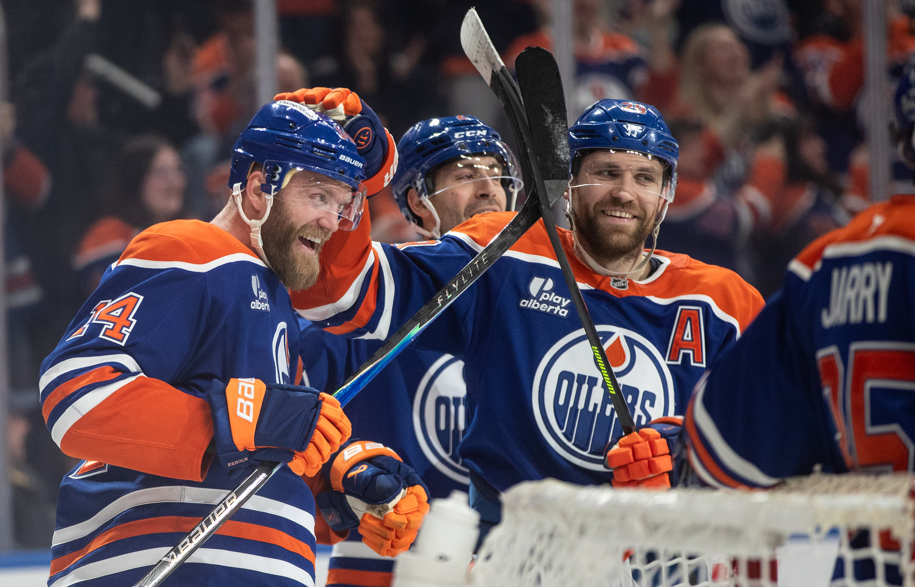 The Edmonton Oilers’ Mattias Ekholm (14) celebrates with teammates Evan...