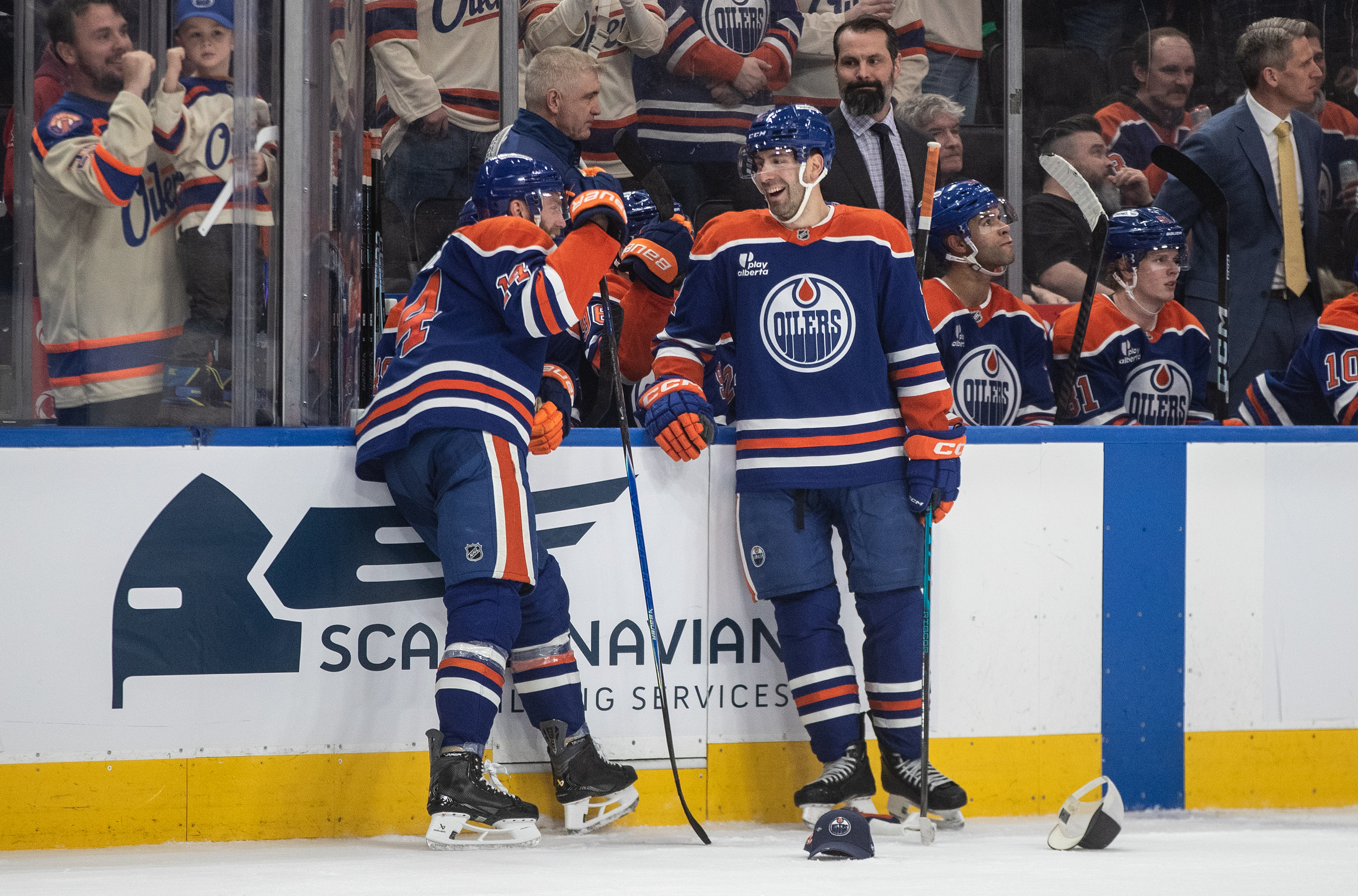 The Edmonton Oilers’ Mattias Ekholm, left, and Evan Bouchard laugh...