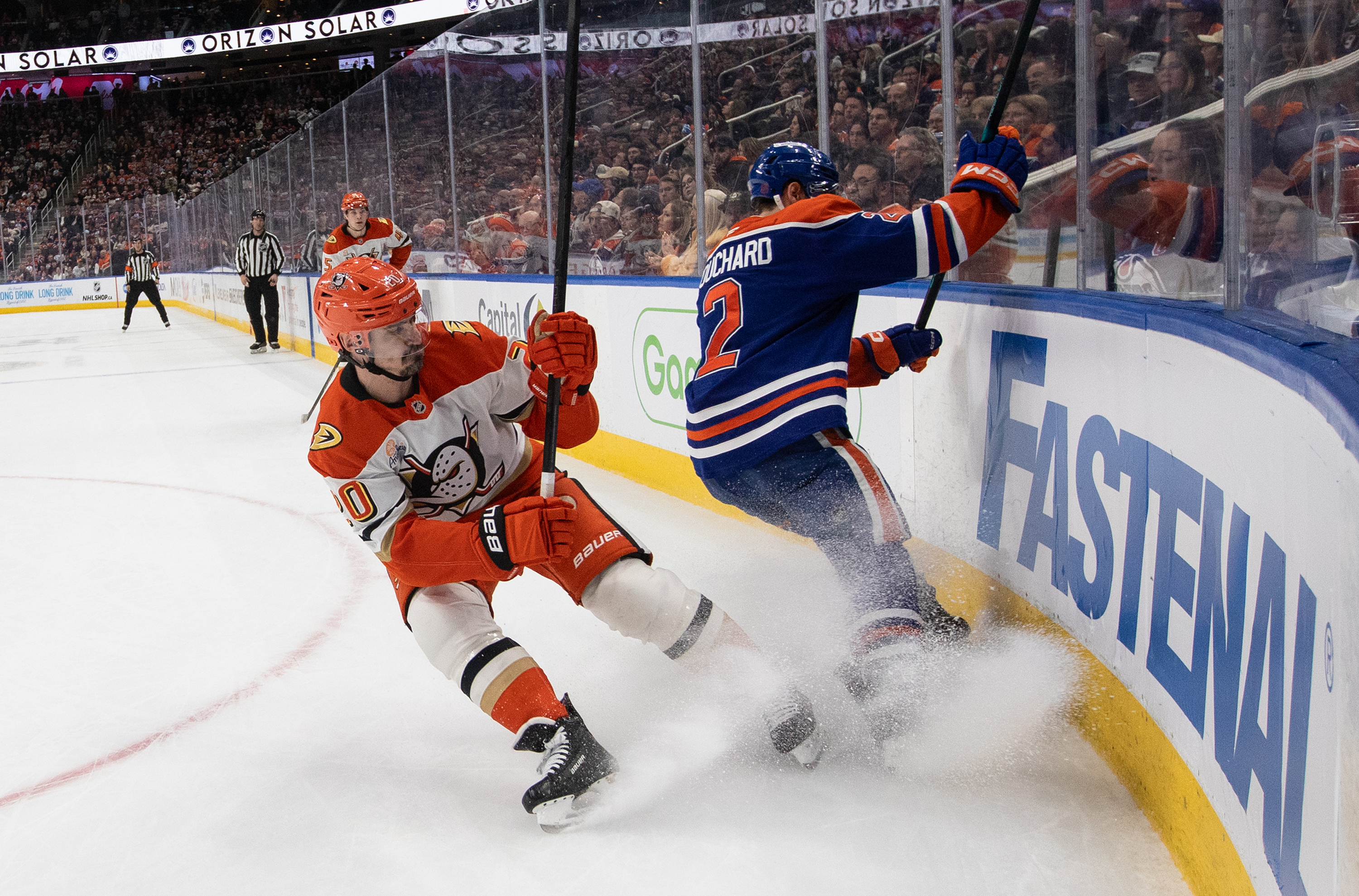 The Ducks’ Chris Kreider, left, and the Edmonton Oilers’ Evan...