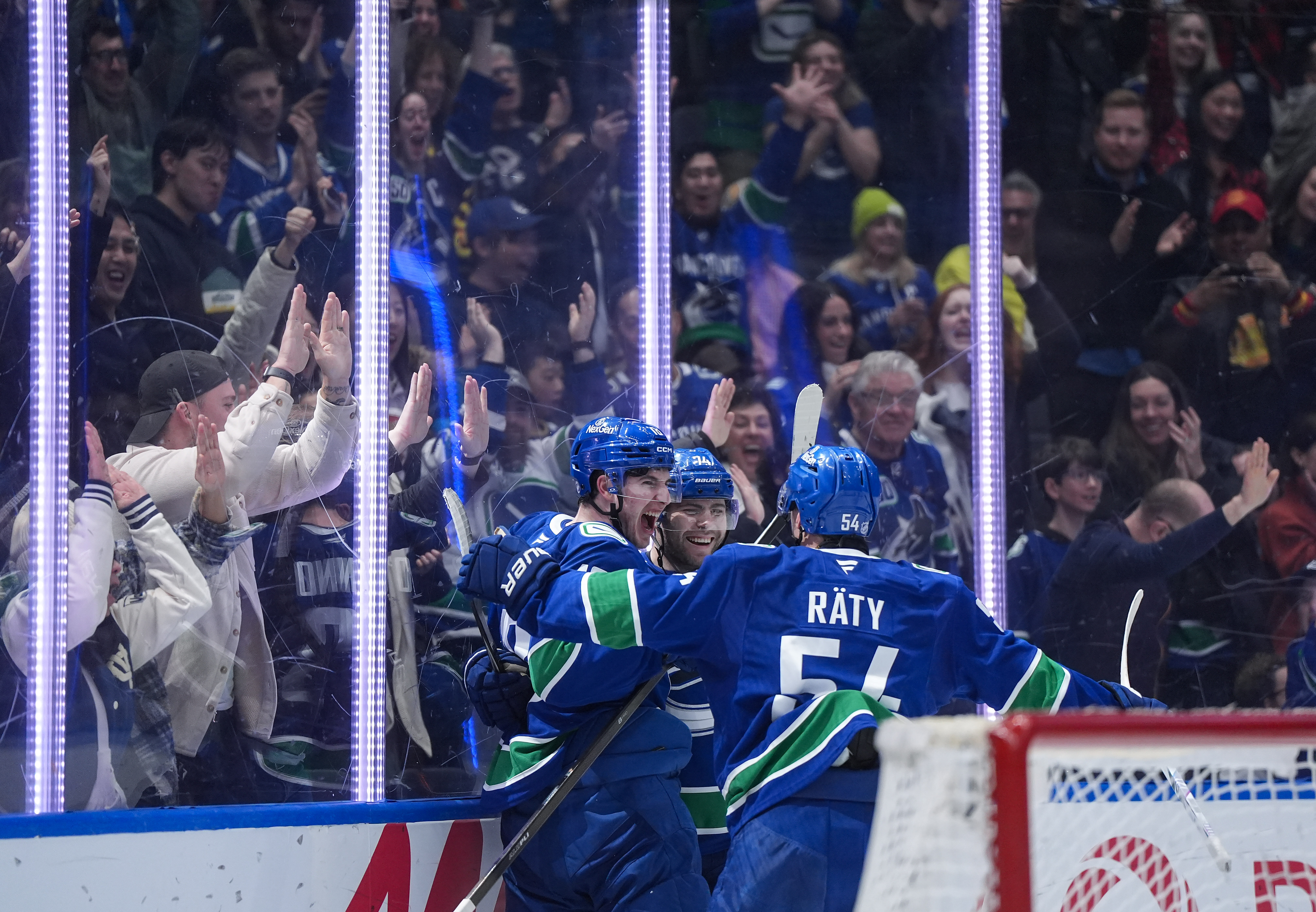 The Vancouver Canucks’ Drew O’Connor (18), Jake DeBrusk (74) and...