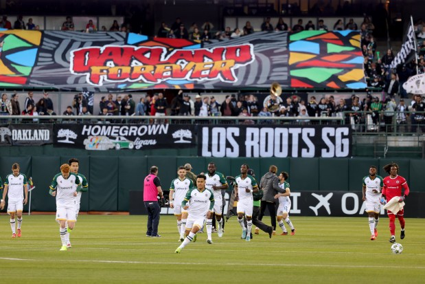 Oakland Roots take the field before the start of the home opener kick-off against the San Antonio FC at the Oakland-Alameda County Coliseum in Oakland, Calif., on Saturday, March 22, 2025. (Ray Chavez/Bay Area News Group)