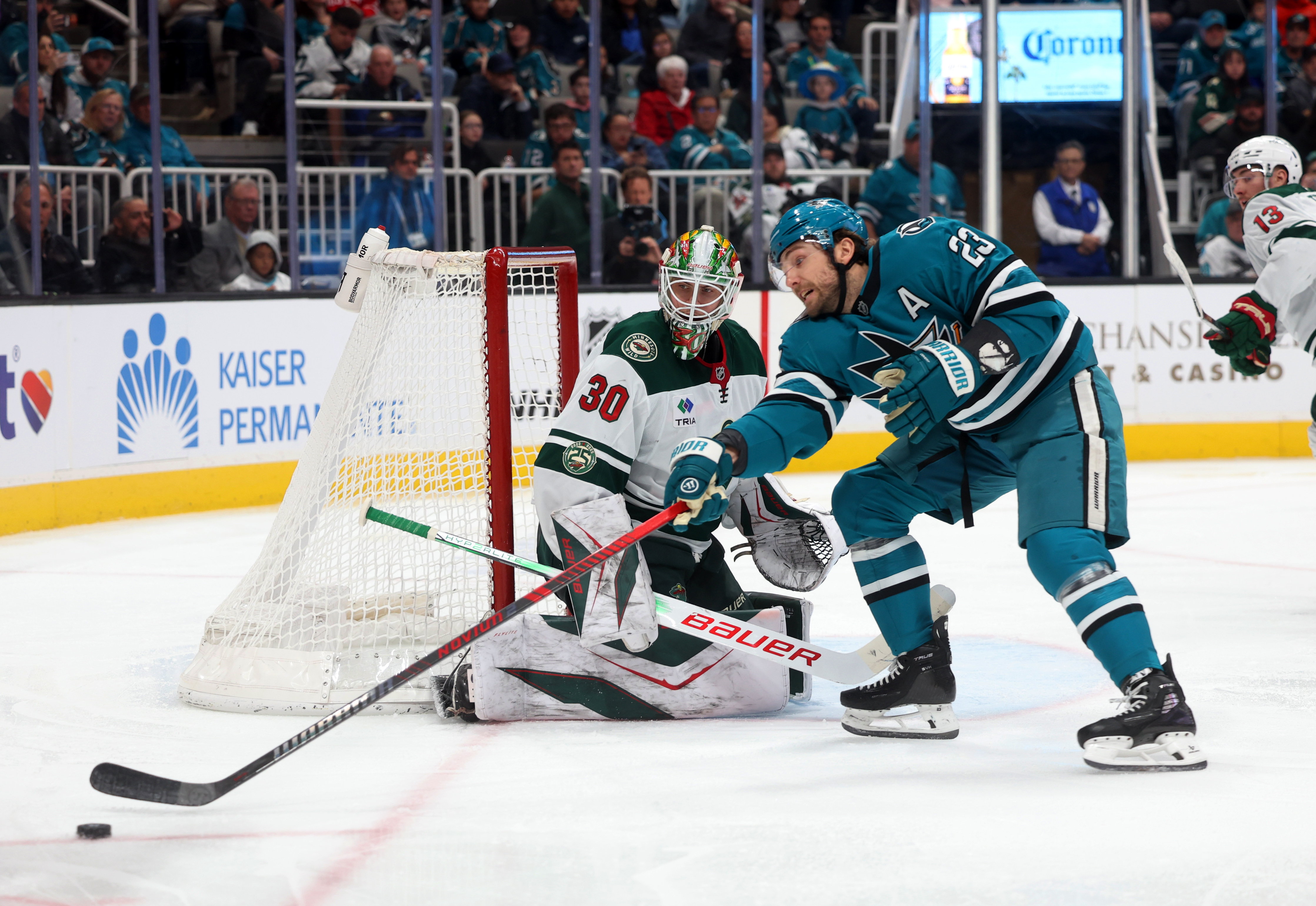 San Jose Sharks forward Barclay Goodrow (23) works to move...
