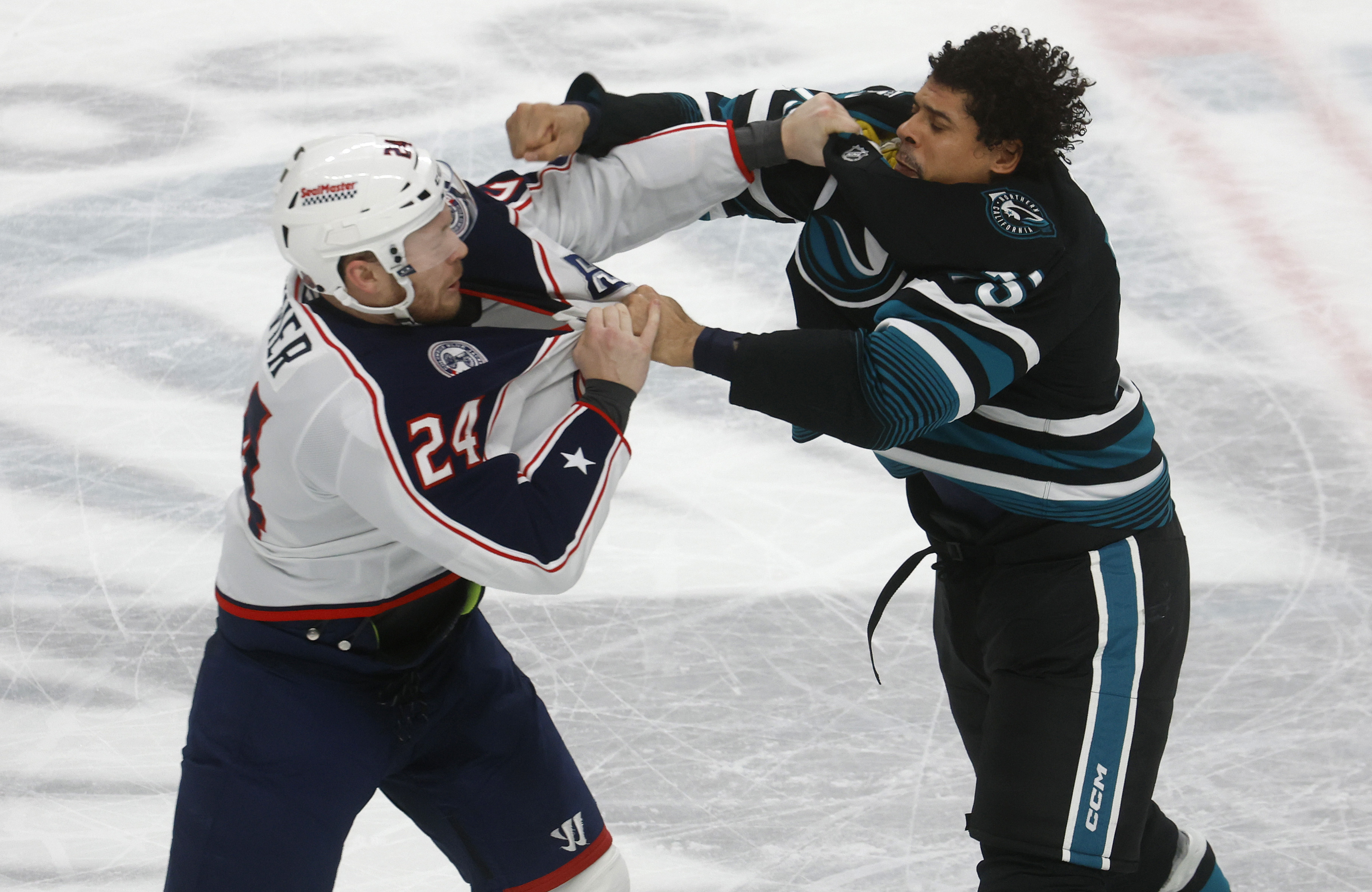 San Jose Sharks’ Ryan Reaves (75) fights with Columbus Blue...