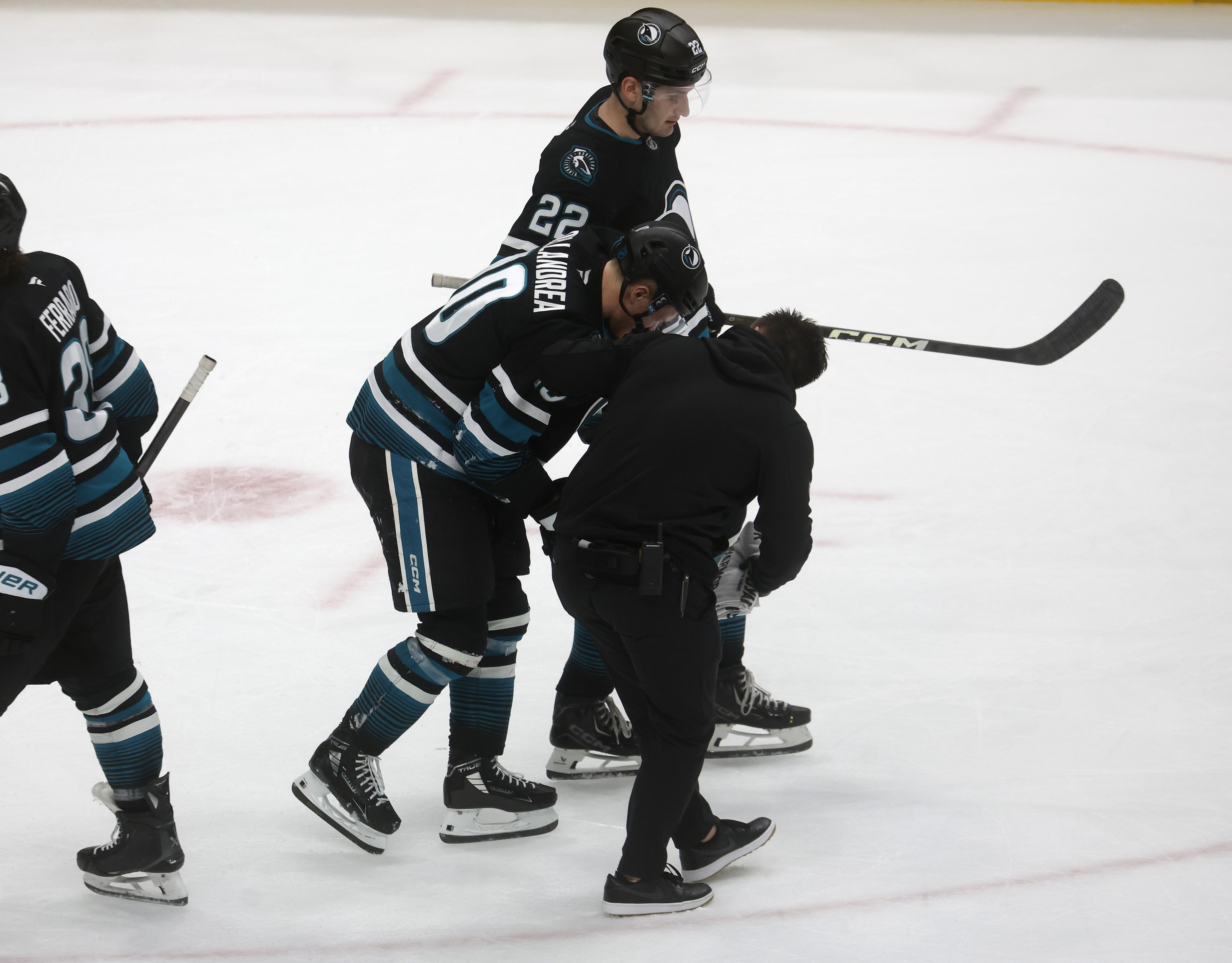 San Jose Sharks’ Ty Dellandrea (10) is helped off the...