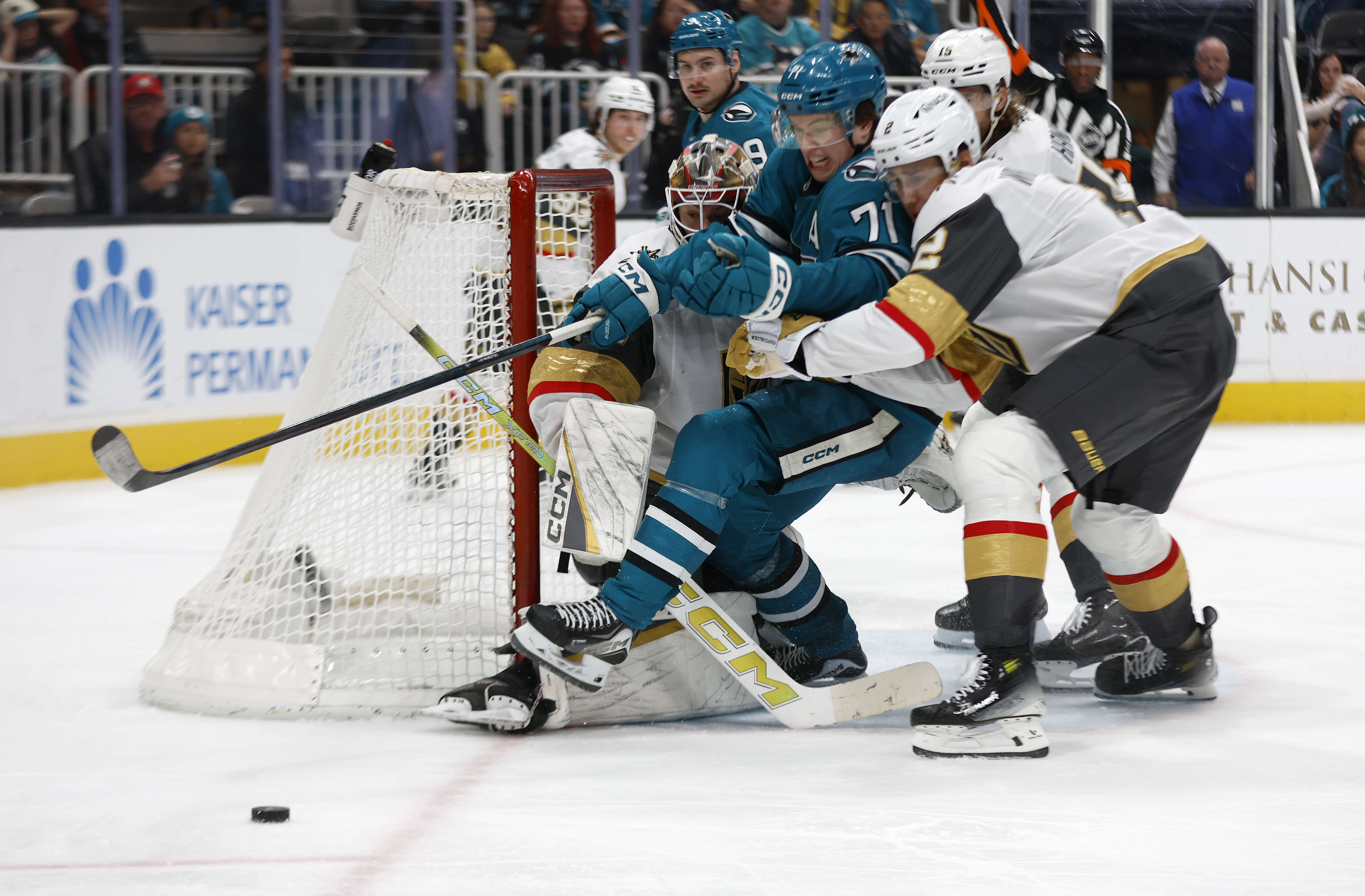 San Jose Sharks’ Macklin Celebrini (71) tries to get to...