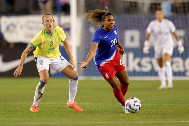 USA's Catarina Macario (20) controls the ball ahead of Brazil's Isa Haas (23) during the first half of a friendly soccer match at PayPal Park in San Jose, Calif., on Tuesday, April 8, 2025. (Ray Chavez/Bay Area News Group)
