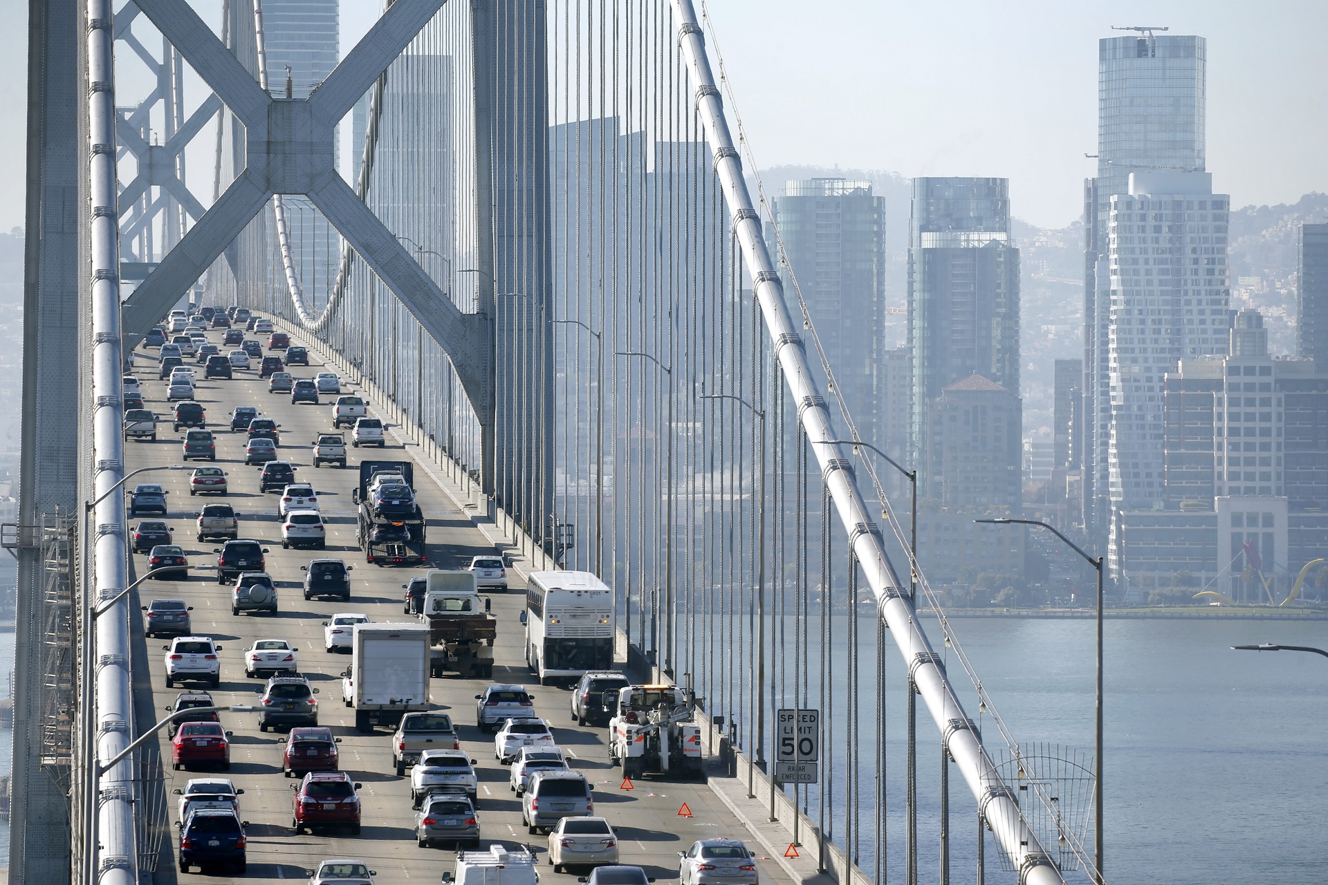 Bay Bridge aerial shot with traffic. The San Francisco city skyline in the background.