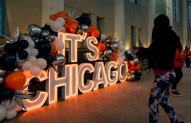 Fans take pictures with an "It's Chicago" sign before the Chicago Bears face the Los Angeles Rams on Jan. 18, 2026, in an NFC divisional playoff game at Soldier Field. (Brian Cassella)