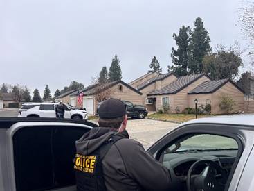 Agents in Fresno conduct a compliance check on parole supervised people.