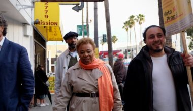 Barbara Lee walking down Mission Street next to Kevin Ortiz, president of the San Francisco Latinx Democratic Club