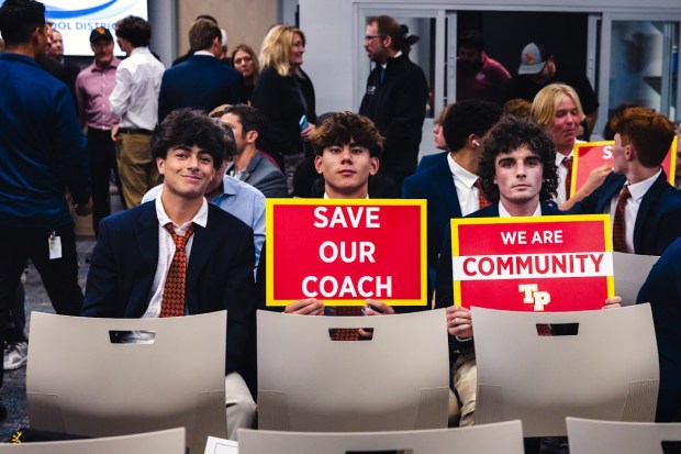 Torrey Pines High School lacrosse players showed support for Coach Jono Zissi, whose contract was not renewed for the upcoming season at the Oct. 16 San Dieguito Union High School District board meeting. (Efstathios Geronikolaou)