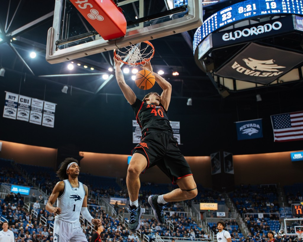 SDSU 73, Nevada 68 ... game-changing timeouts, a resurgent Taj DeGourville and the Wolf Pack's new home