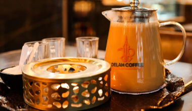 A pot of coffee with cream from Delah Coffee.