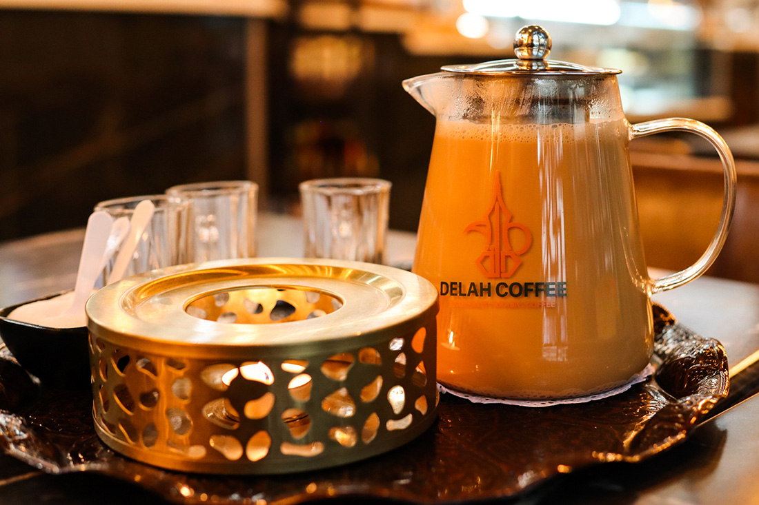 A pot of coffee with cream from Delah Coffee.