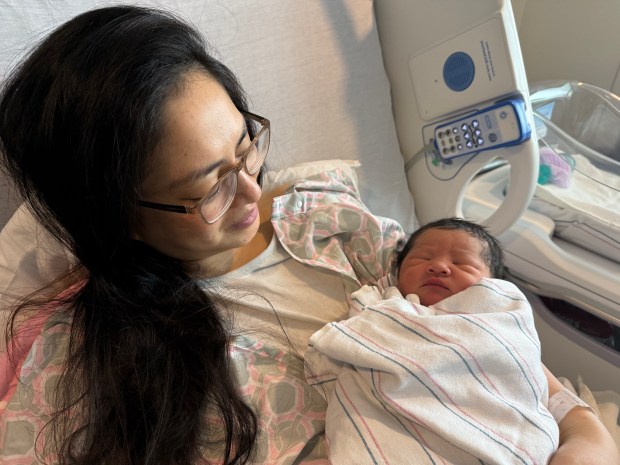 Barishma Asem cradles her newborn boy, Wangthoi, at Good Samaritan Hospital in San Jose on Jan. 1, 2026. Asem gave birth to Wangthoi at 12:11 a.m., making him the first baby born in San Jose in 2026.