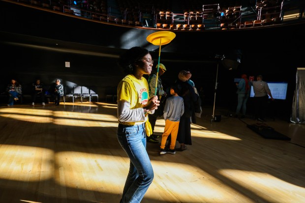 Nainique Younger, 16, of the Prescott Circus, walks around with a spinning plate as visitors tour the Henry J. Kaiser Center for the Arts after a ribbon-cutting ceremony with Oakland Mayor Barbara Lee in Oakland, Calif., on Saturday, Jan. 24, 2026. (Ray Chavez/Bay Area News Group)