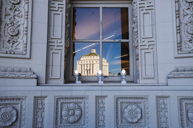 The Alameda County Superior Court building is reflected in a window of the Henry J. Kaiser Center for the Arts during the ribbon-cutting ceremony with Oakland Mayor Barbara Lee in Oakland, Calif., on Saturday, Jan. 24, 2026. (Ray Chavez/Bay Area News Group)