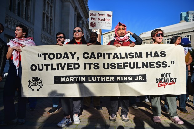 People begin to march during the 12th annual Reclaim MLK March at Frank H. Ogawa Plaza in Oakland, Calif., on Monday, Jan. 19, 2026. (Jose Carlos Fajardo/Bay Area News Group)