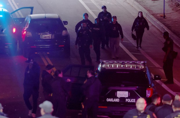 Police detain a suspect on Webster Avenue near 34th Street after a police pursuit in Oakland, Calif., on Tuesday, Jan. 27, 2026. (Jane Tyska/Bay Area News Group)