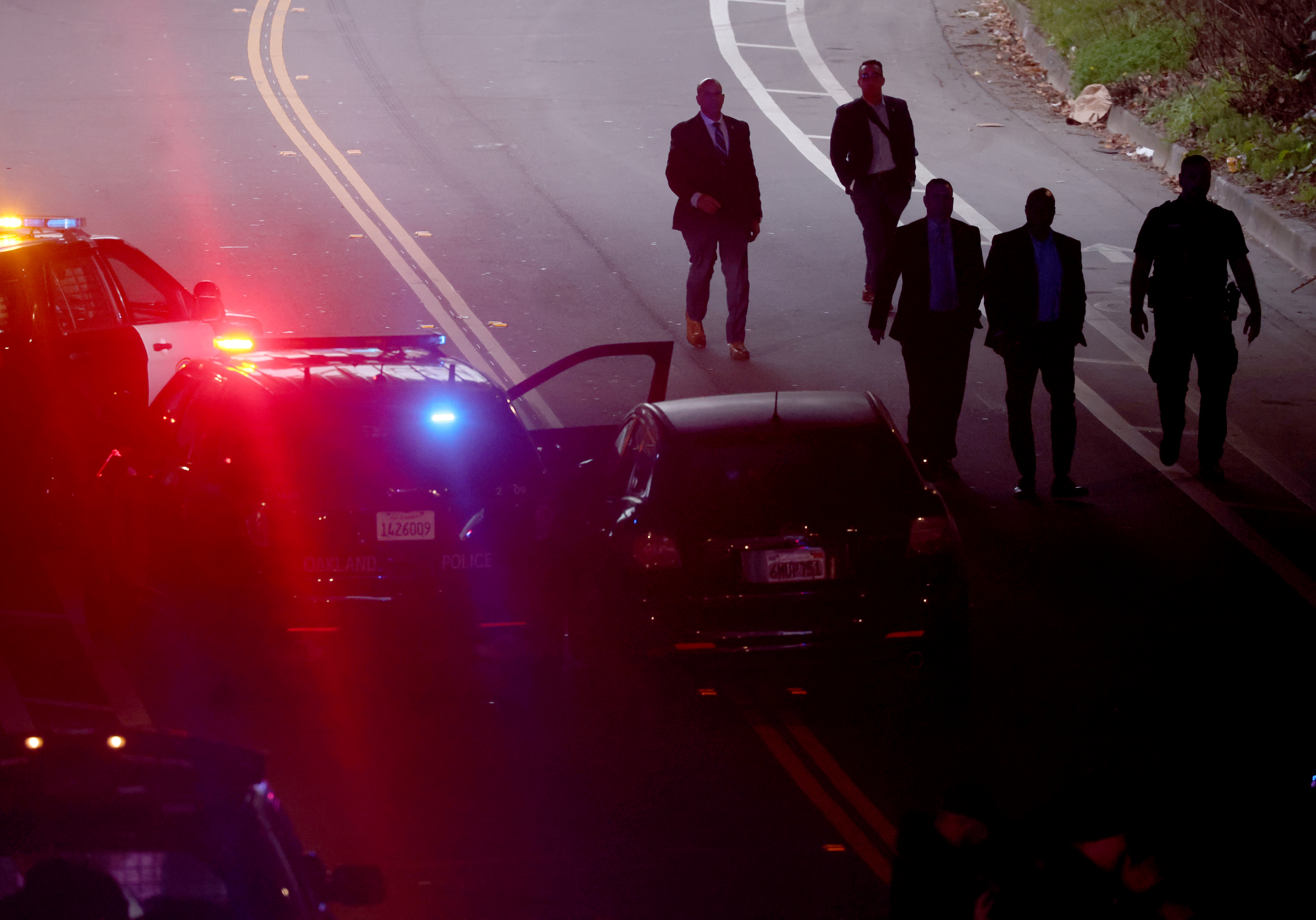 Oakland police detectives investigate the scene on Webster Avenue near...