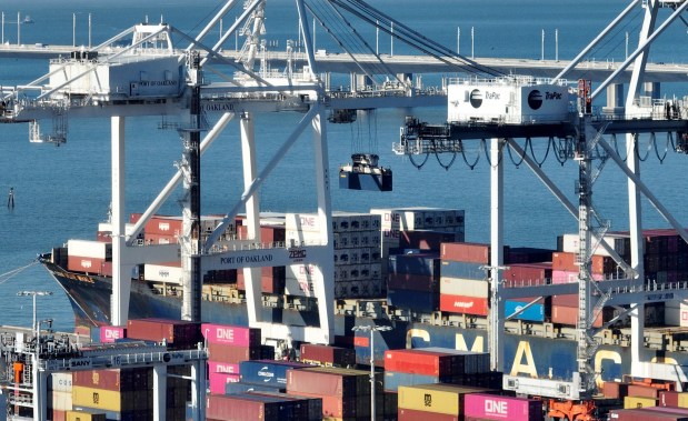 A container ship unloads its cargo at the Port of Oakland's Outer Harbor from this aerial view in Oakland, Calif., on Tuesday, Jan. 13, 2026. (Jane Tyska/Bay Area News Group)