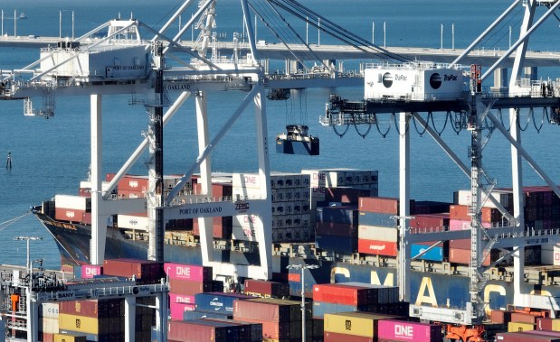 A container ship unloads its cargo at the Port of Oakland's Outer Harbor from this aerial view in Oakland, Calif., on Tuesday, Jan. 13, 2026. (Jane Tyska/Bay Area News Group)