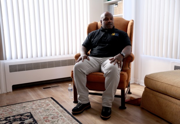 Director George K.L. Smith in the living room at the Academy of Healing Opportunities and Personal Enrichment (HOPE) in Oakland, Calif., on Monday, Nov. 3, 2025. Smith, who was incarcerated for 26 years, now works with other former inmates through Options Recovery Services. (Jane Tyska/Bay Area News Group)