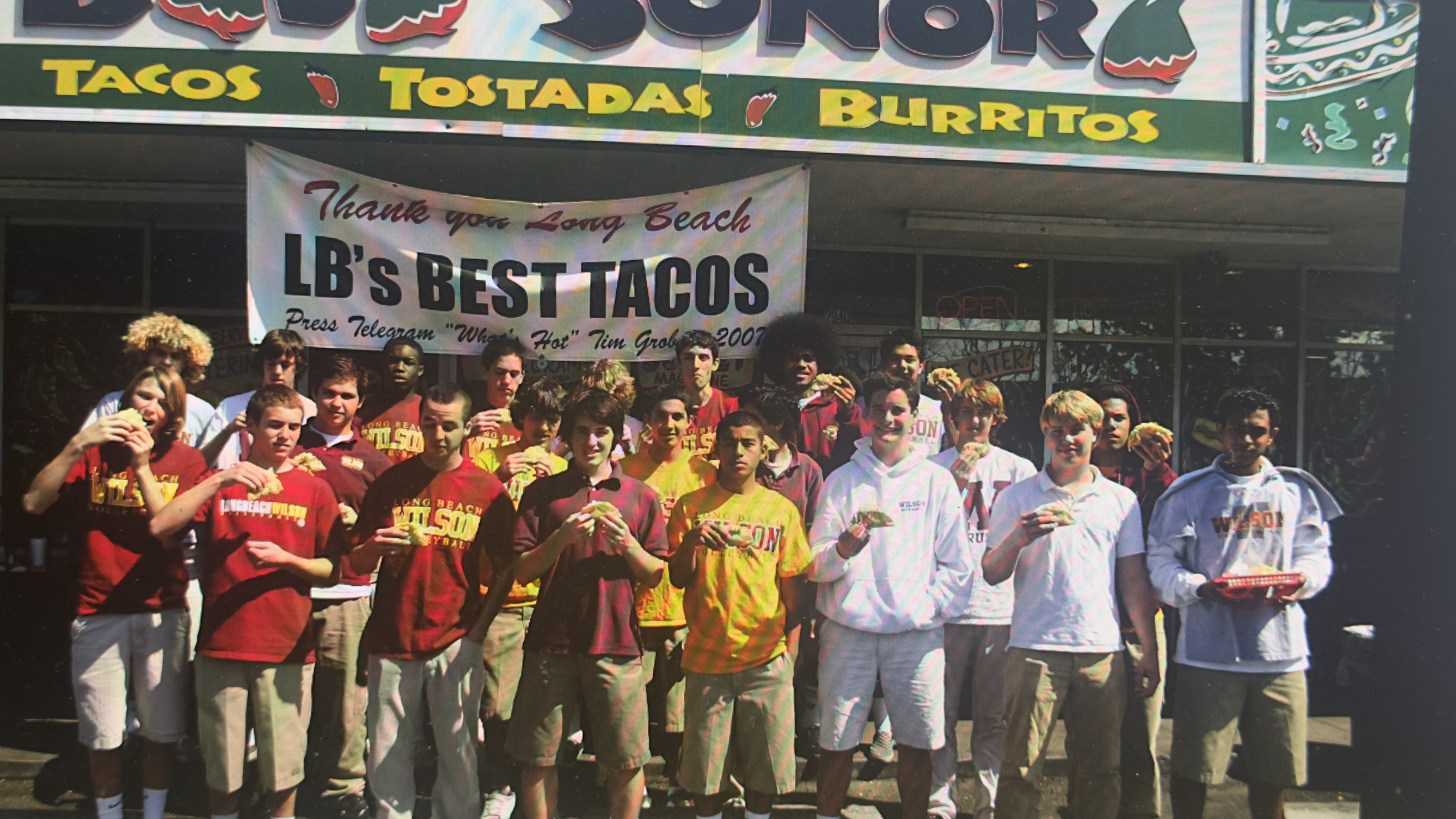 Wilson High athletes post with tacos in front of Baja...
