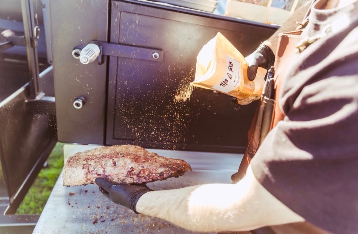 Daniel Matheny seasons up some meat for his pop-up, BYO...