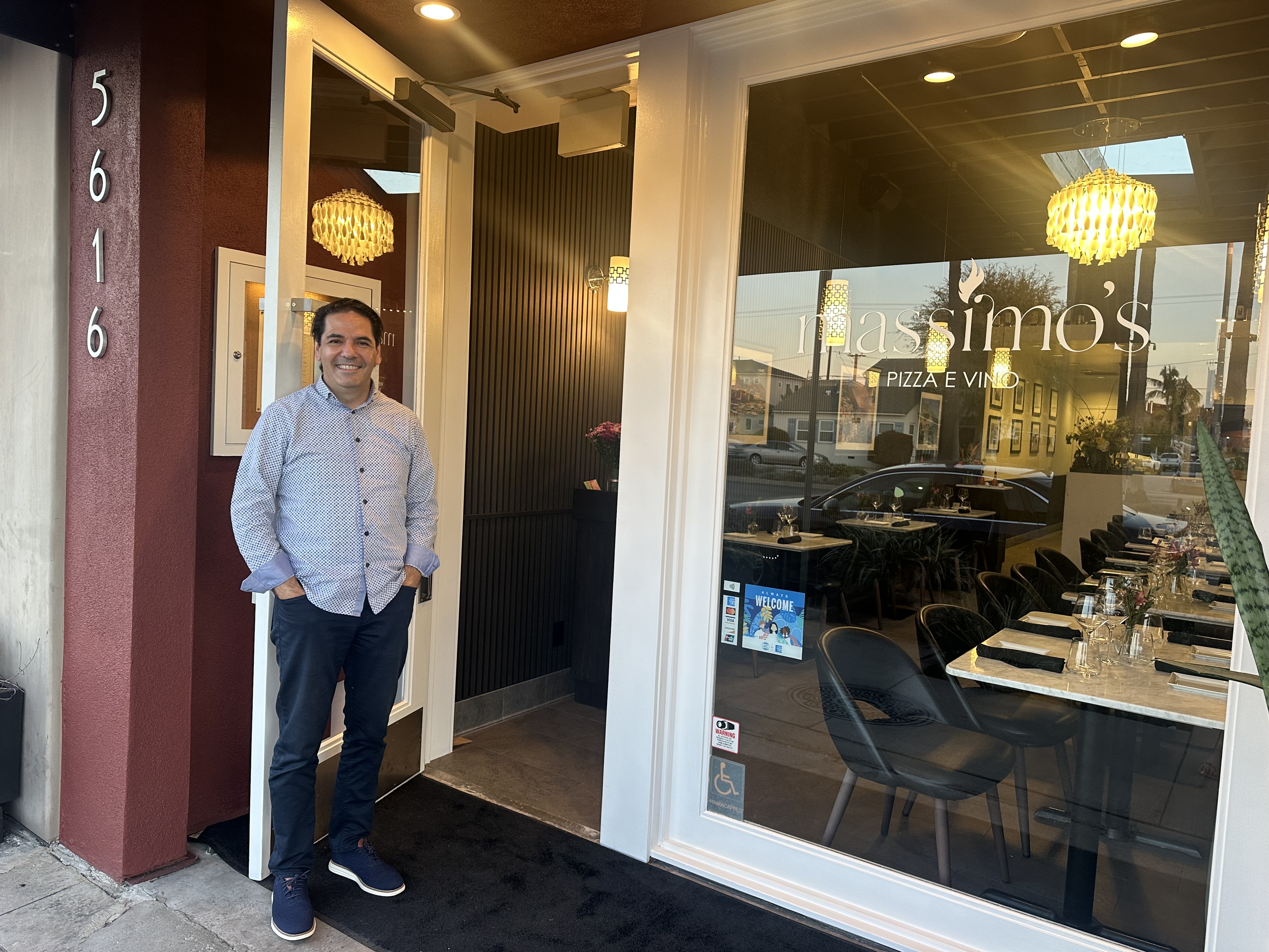 Massimo Aronne poses outside his new restaurant in Belmont Shore....