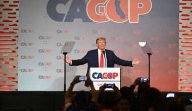 Donald Trump speaks in front of a lectern, with the words 'CAGOP' behind him.