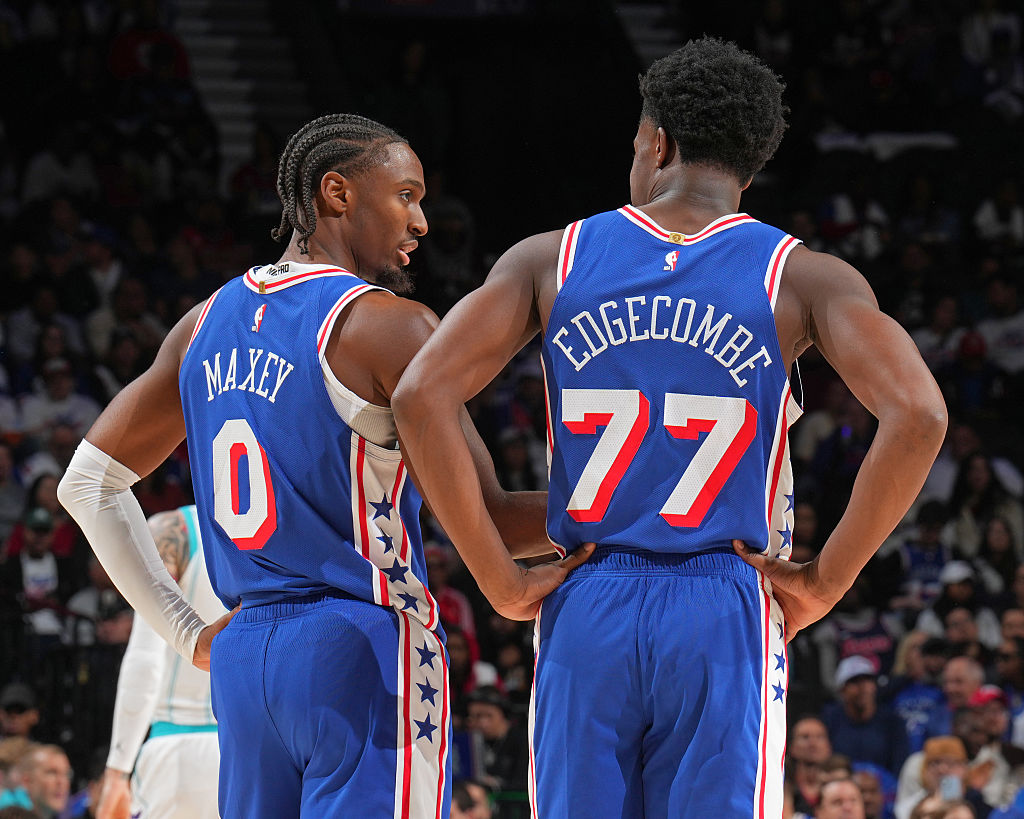 PHILADELPHIA, PA - OCTOBER 25: Tyrese Maxey #0 and VJ Edgecombe #77 of the Philadelphia 76ers looks on during the game against the Charlotte Hornets on October 25, 2025 at the Wells Fargo Center in Philadelphia, Pennsylvania NOTE TO USER: User expressly acknowledges and agrees that, by downloading and/or using this Photograph, user is consenting to the terms and conditions of the Getty Images License Agreement. Mandatory Copyright Notice: Copyright 2025 NBAE (Photo by Jesse D. Garrabrant/NBAE via Getty Images)