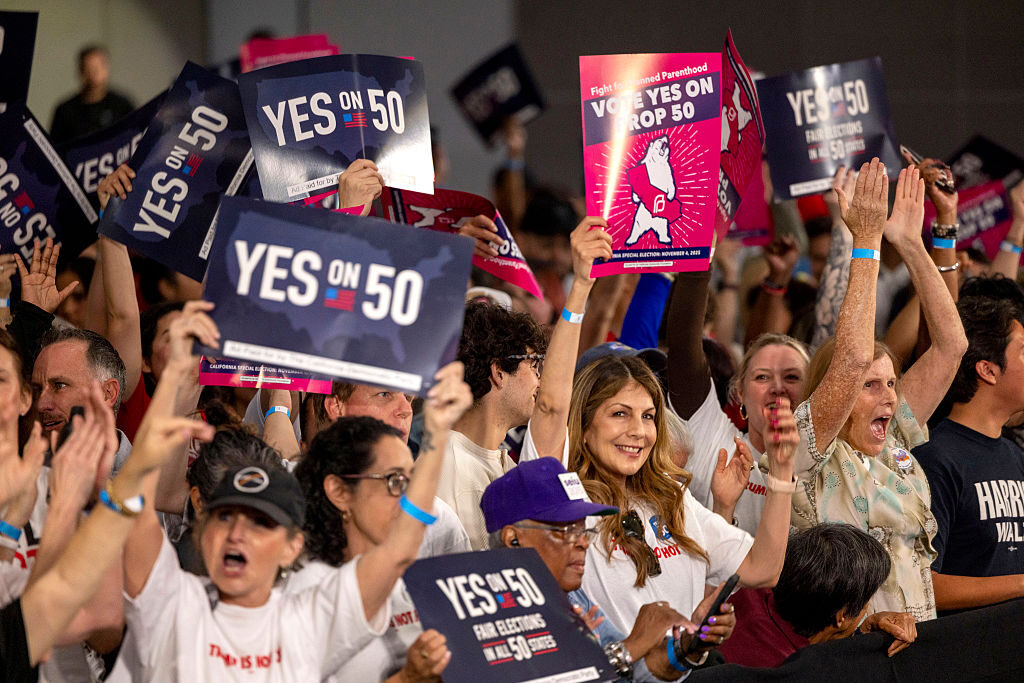 A crowd of mostly volunteers who worked on Prop 50 cheer at a "Yes On Prop 50" volunteer event at the LA Convention Center in November in Los Angeles.
