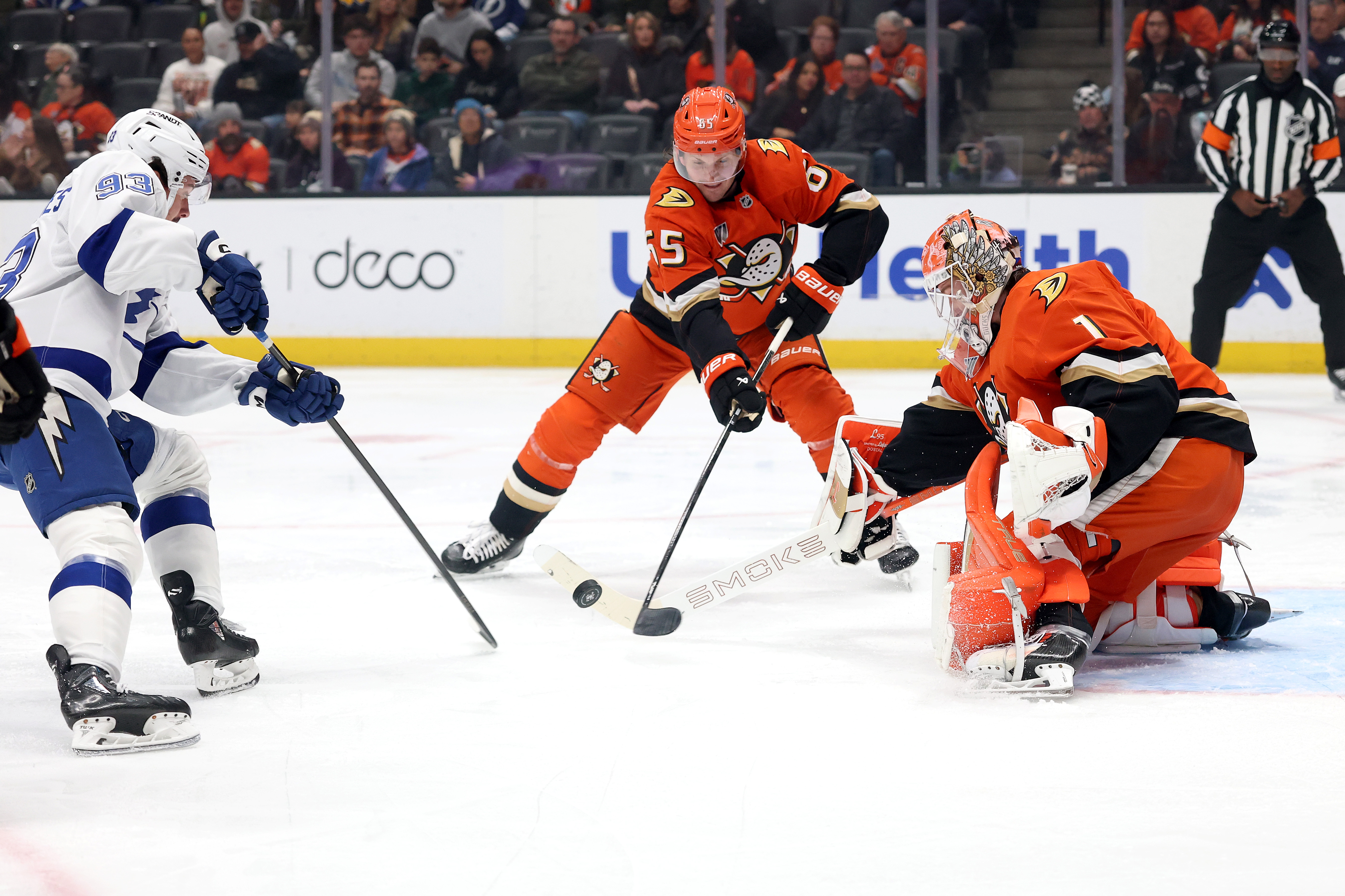 The Tampa Bay Lightning’s Gage Goncalves, left, pokes at a...