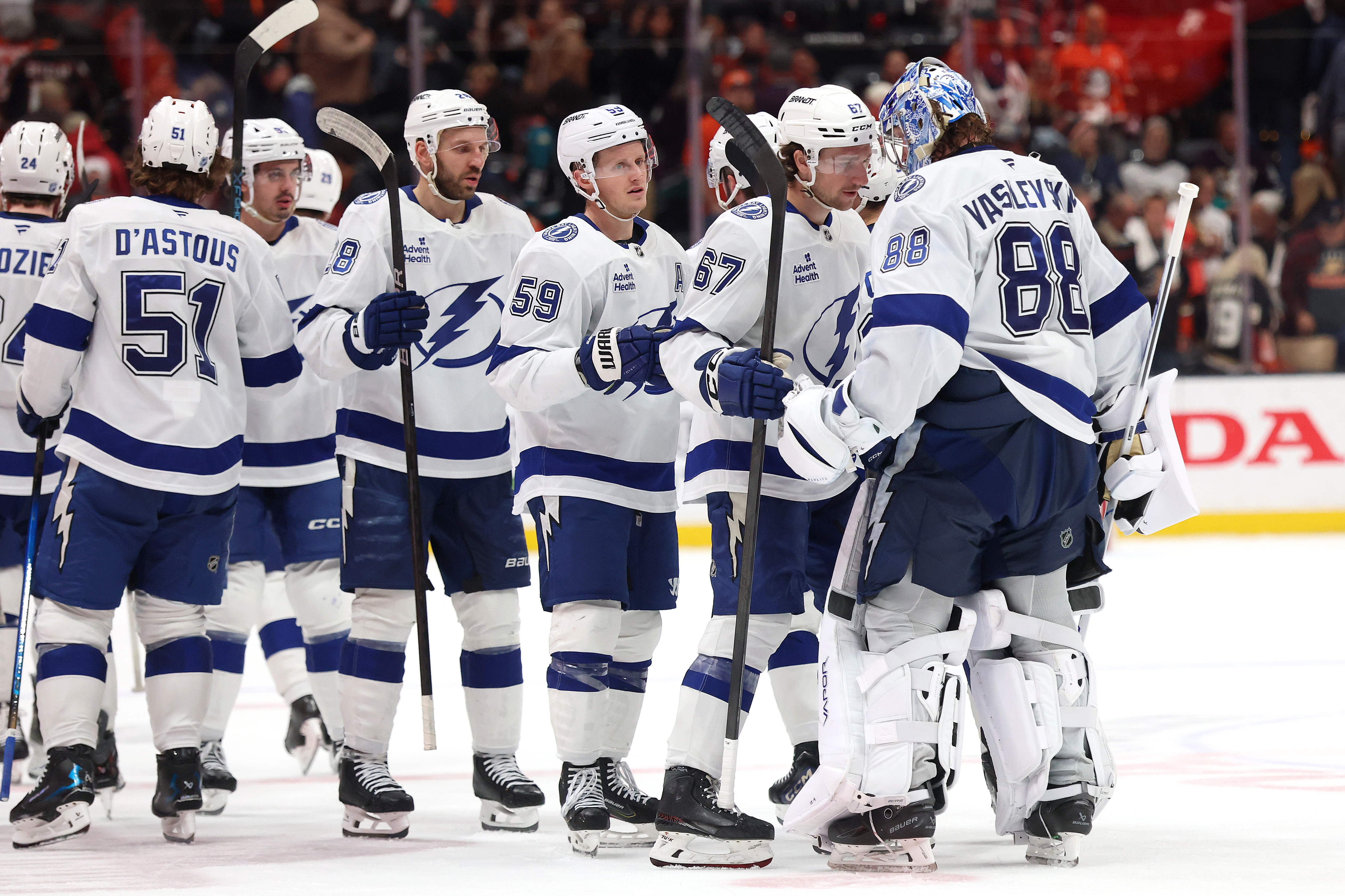 Teammates congratulate Tampa Bay Lightning goaltender Andrei Vasilevskiy, far right,...