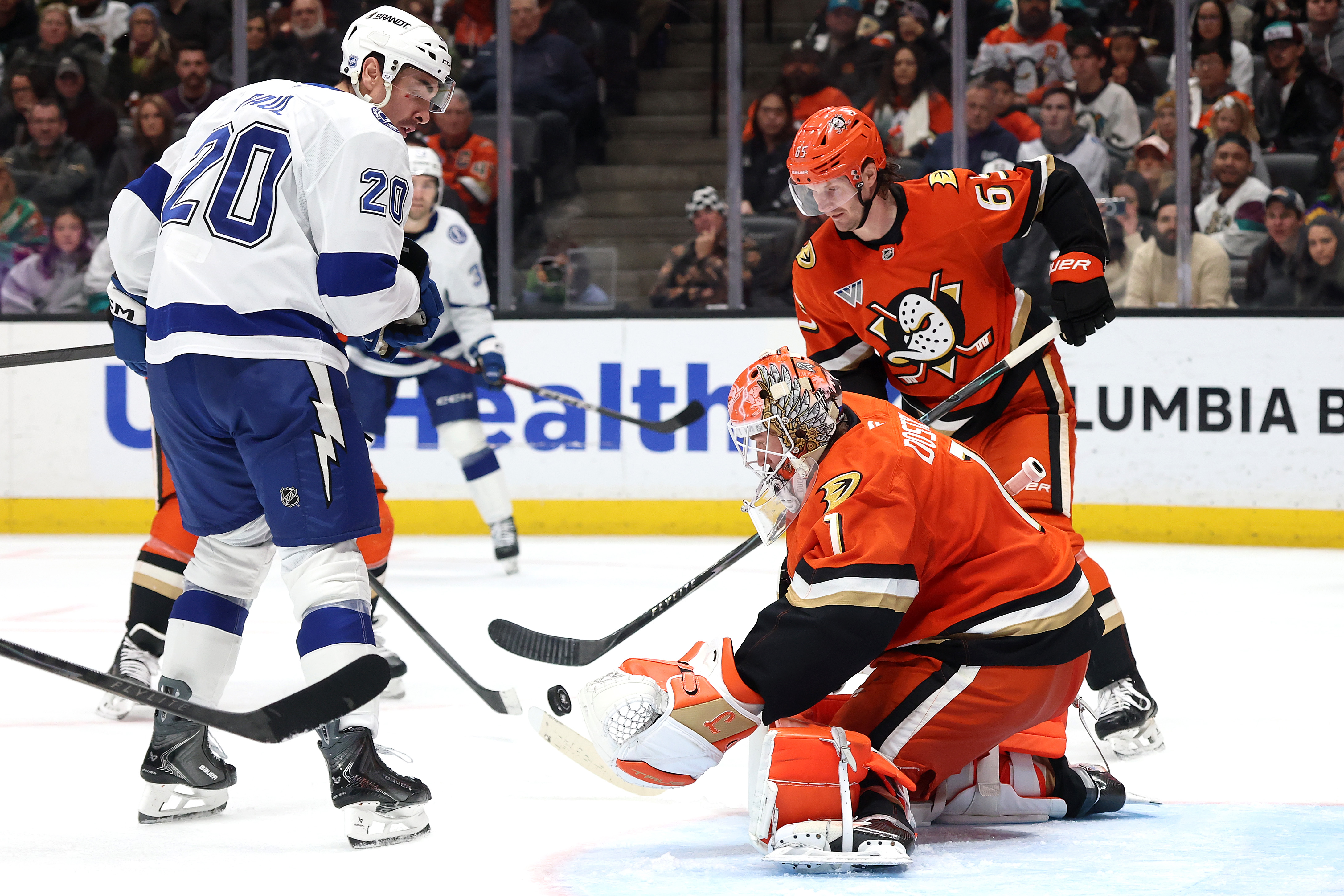 Ducks goaltender Lukas Dostal (1) and defenseman Jacob Trouba (65)...